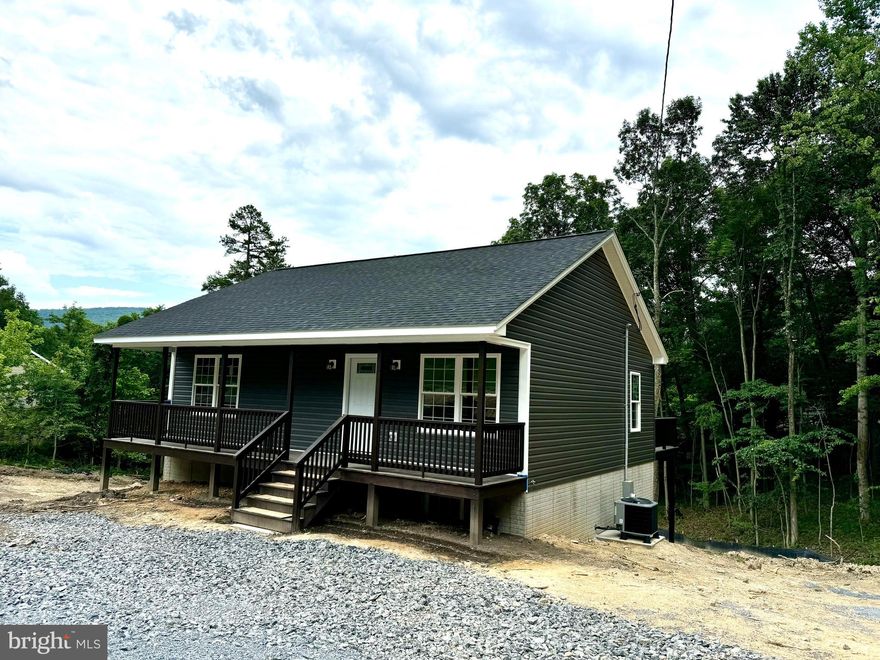 Ready for delivery in 30 days OR LESS! Gorgeous Brand New Home just minutes to the Shenandoah River, 2 lakes, recreation areas, basketball court, multiple river lots, boat ramp, 2 country stores, and many other community amenities. Home features a gorgeous living space in an open concept floor plan. Spacious Country Kitchen with stainless appliances, Incredible amount of storage within the white soft close cabinets, Large peninsula with overhang for bar stools as well as a separate table area, waterproof LVP flooring throughout main level for an elegant look and feel while enjoying the easy maintenance, spacious bedrooms featuring dual flip clean windows, master offers an impressive walk in closet & double vanities in bath. Walk in closet in 2nd bedroom. Ample storage throughout. Nickel finishes, all LED lights, fully covered front porch with recessed lighting, rear deck off kitchen for grilling or entertaining. All exterior wood is stained/sealed by builder for your convenience. Rough in for 3rd bath and 3rd bedroom in basement, could be a 2nd master. Comcast/Xfinity internet available. County maintained roads. Just a short distance to route 50 and I-66 as well as town of Front Royal. Location pin is set correctly in MLS but is showing up incorrectly on some third party sites. AGENTS: PLEASE VERIFY YOUR CLIENTS FINANCIAL/LOAN ELIGIBILITY PRIOR TO SUBMITTING AN OFFER!!!