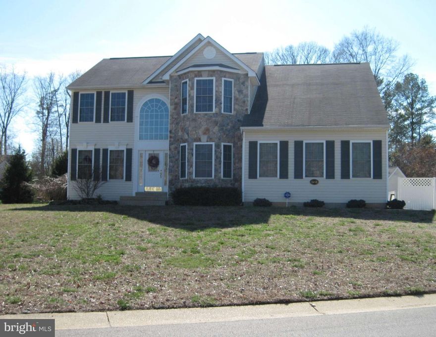 Motivated Seller!! Well maintained 3 story colonial with  open foyer,  5 BRs 3.5 baths, spacious kitchen, sunken FR w/gas fireplace, formal LR & DR, library/office, sitting room, vaulted ceiling, walk-in closet in MBR suite, large MBR bath w/soaking tub & separate shower, finished basement w/ large rec. room, 5th BR & full bath. 16x26  Victorian covered Trex  vinyl rear porch, 2 side load garage.