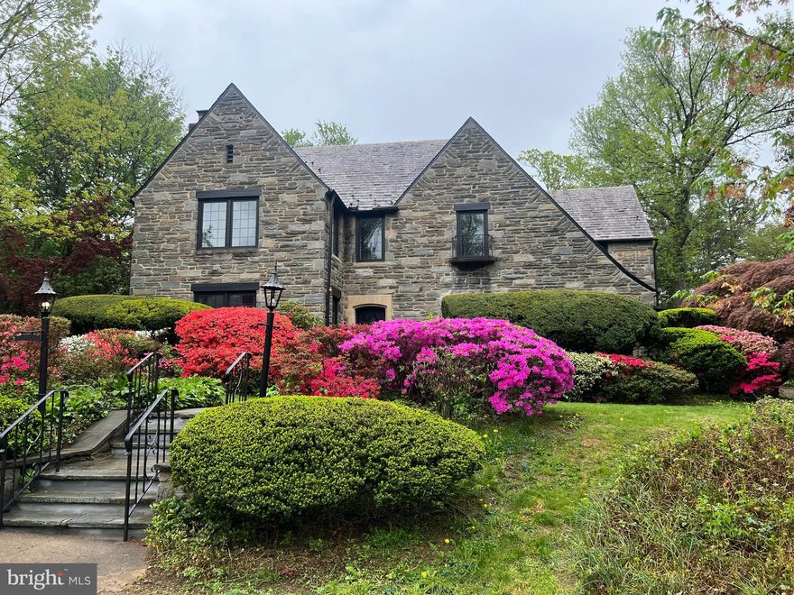 This stunning Mt. Airy Tudor stone single will take your breath away! Situated on half an acre of beautifully
landscaped grounds, the house has been meticulously renovated from top to bottom: new kitchen,
new bathrooms, new plumbing, new electric, new HVAC, new Marvin windows – the works! No
expense has been spared in the tasteful restoration of the home’s original architectural details with
stylish modern amenities. Approach the house along a bluestone walkway and enter to find a
generously sized foyer with gleaming hardwood floors. The spacious living room features a beautiful
original fireplace with marble mantel and plaster crown molding. Beyond the formal living room is a
cozy family room featuring original built-in bookshelves, leaded glass windows, and a tiled fireplace
in mint condition. An elegant formal dining room with an ornate original chandelier looks out onto
one of the home’s two enclosed porches. The breakfast room flows into the showstopper brand-new
kitchen! Thoughtfully designed by and for the experienced chef, the large kitchen features GE Café
appliances, quartz countertops, custom cabinetry, a large farm sink, an expansive island, and a bar
with a Sub-Zero wine fridge and prep sink. Enjoy the secluded fenced-in rear yard with flagstone
patio, perfect for outdoor entertaining. The second floor features 5 generous bedrooms and 4 full
bathrooms. The primary suite is a luxurious private oasis with en suite bath featuring a steam
shower, large soaking tub, double vanity, and floor to ceiling Carrara marble. Bedrooms have large
energy efficient casement windows, deep sills, big closets, and lots of sunlight. The bathrooms are all
beautifully renovated and stylishly appointed with high-end finishes. The basement has a fabulous,
finished family room with an original wet bar and powder room. Connected to the house is a two-
car garage and newly paved driveway that can accommodate 3-4 cars. This enchanting home has
tremendous curb appeal and is move-in-ready. Conveniently located close to Chestnut Hill, public
transportation, and the many charming shops, cafes, bars and restaurants in downtown Mount Airy.