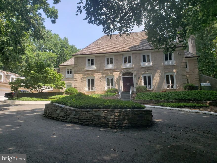 Reduced for Unbelievable Value in Potomac Village...Stunning  Estate Sale, Situated on Over Two Acres of Prime Parkland Like Setting with Low Maintenance Upkeep. One and a half Miles From Village Shopping and Potomac Elementary School only Blocks away. Magnificent Wooded Parcel Perched High Above The Street Features A Swimming Pool with Electric Cover, Tennis Court & Sport Court, Detached Guest House With High Ceilings and Kitchen and Two Baths, Eight Person Spa & two Story Elevator!! ...2.17 Acres...Private Estate.. Fully Fenced Rear Yard for Pets. 

Two-Story Foyer. Luxurious Crown Moldings and Extensive Mill Work Throughout The Home.  Custom Niches, Accents and Embassy Sized Rooms.  Newly Painted Walls, Solid Doors, High End Built-Ins and Shelves Throughout The Home. Multiple Wood Burning Fireplaces Located On Each Level. Gourmet Island Kitchen With Granite Counters, Built-In Desk and Breakfast Table. Full Wet Bar In  Family Room. Huge Sun Room,  Massive Back Yard Oasis.  Primary Suite With Tray Ceilings.  Two-Story Elevator Connects Garage and Primary Bedroom. Elevator Is Equipped with State-Of-The-Art Software.. Beautiful Home Office with Fireplace and Built-In Shelves Off The Primary Suite. Main Home Has Five Bedrooms PLUS DEN, Five Full Baths, Two Half Baths. Add Approximately 750 Finished Living S.F. with Guest Home. Guest Home Offers High Ceilings, Lots of Windows and Is Equipped with A Second Kitchen and An Additional Two Full Bath + Three Garages Below = Five Garage Total for Collector Car Enthusiasts...(One Full Bath on Main Level Of Exterior Gust Home for Swim/Tennis Guests to Refresh, Change clothes without coming Inside...
Attention Home Business Owners, Multi-Generational Living Opportunity, Expanded and Growing Households, Rental Income from Guest House...A Life-Long Residence That Checks All Of The Boxes. More Development Potential Remains for Investors.  Final Cosmetic Touches Remain for The Next Owner.  Move-In Ready. Create a Lifetime of Memories Here.  Enjoy The Close-In  Proximity to Potomac Elementary School and Shopping and Restaurants. Only 4 Miles to I-495, 20 Minutes to Reagan Airport, 15 Minutes to Tyson's Corner, 25 Minutes to K Street, 30 Minutes to Dulles. 1 Mile to "Swain's Lock" at C&O Canal For Walks and Bike Rides Along Potomac River. Fully Fenced Backyard for Kids and Pets. Low Maintenance Yard! 
This is an ESTATE SALE  Well maintained! Impossible to Build a Comparable Property At This Price.  Bring Your Decorator and Gain Instant Equity Overnight. Well Maintained Property! Transferable Home Warranty with FAHW.com.