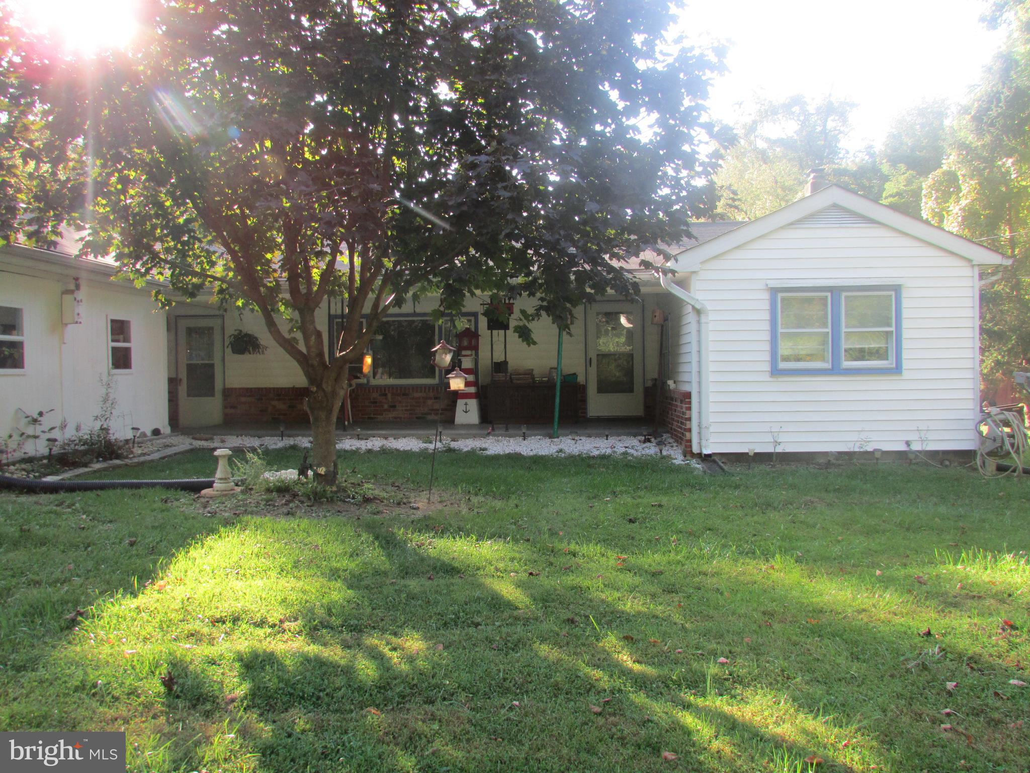 Extremely well built raised rancher with full unfinished basement, hardwood/vinyl floors, laundry room could be converted back to third bedroom. Fenced yard, 3 outbuildings, and a great view of the mountains. Close proximity to the Virginia line, Charles Town, and schools.