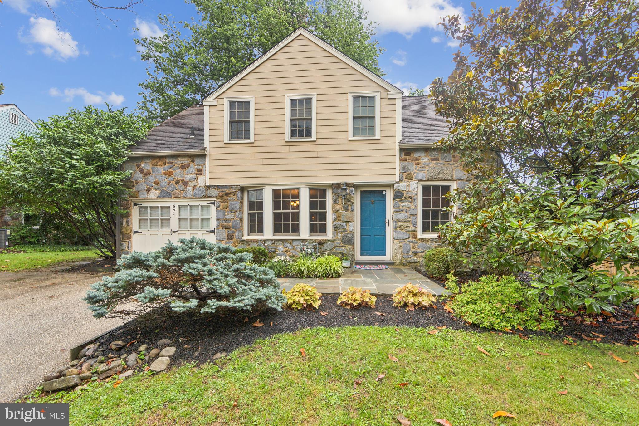 Welcome to 971 West Conestoga Road — where timeless Main Line charm meets modern luxury.
This beautifully updated stone colonial sits in the heart of Berwyn, offering an ideal walk-to-everything location with sidewalks leading to the train, town, and award-winning T/E schools.
Step inside to find sun-filled spaces and exceptional attention to detail throughout. The inviting living room features deep window sills and classic hardwood floors, creating a warm and welcoming atmosphere. The formal dining room is perfect for gatherings, showcasing an elegant bay window and custom millwork.
The chef’s kitchen is a true highlight, designed for both everyday cooking and entertaining. Enjoy custom cabinetry, high-end stainless steel appliances, a Wolf gas range with pot filler, and a built-in Sub-Zero refrigerator. A cozy breakfast area and large pantry provide ample storage and functionality, while an adjacent powder room adds convenience.
Upstairs, the serene primary suite offers recessed lighting, a custom built-in reading nook, and a spacious closet. Two additional well-sized bedrooms each include generous closets, ceiling fans, and recessed lighting. The updated hall bath features a modern vanity, porcelain tub, and stylish tile flooring.
The lower level expands your living space with a partially finished area highlighted by exposed stone walls, hardwood flooring, and an egress window — perfect for a playroom, home office, or media space. Additional storage, laundry area, and mechanicals complete this level.
Step outside to your private, fenced backyard oasis. A blue stone patio with exterior lighting creates a perfect setting for outdoor dining and entertaining. The lush landscaping offers year-round greenery, and a storage shed adds extra convenience.
This meticulously maintained home blends classic colonial character with thoughtful modern updates — a true move-in-ready gem in one of Berwyn’s most desirable neighborhoods.
Don’t miss your chance to make this picture-perfect property your next home!