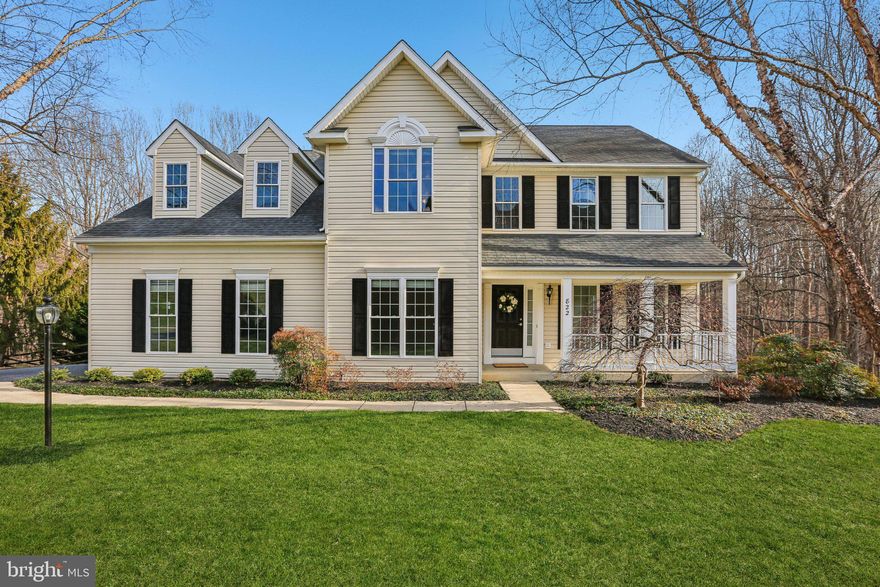 Be prepared to fall in love with this stunning property. Homes in Edgewood  sell quickly, so make sure you’re the first to experience this gem with its serene, private setting. Step inside where you're greeted by a two-story foyer leading to an expansive and well-thought-out floor plan. The elegance of refinished hardwood floors flows through the foyer, powder room, kitchen, and family room, creating a seamless blend of style and function. The gourmet kitchen is a chef’s delight featuring sleek quartz countertops, white cabinetry, a center island, and top-of-the-line stainless steel appliances with gas cooking. Cozy up by the gas fireplace in the inviting family room, part of an open-concept space perfectly connecting to the kitchen. The natural daylight streams throughout this space with windows galore! Step outside onto the expansive deck, equipped with new railings, stairs that leads to a fenced yard sloping toward a community trail and picturesque woods. The main level shines with sophisticated finishes, including luxury crown moldings, adding a touch of elegance to your home. Brand new plush carpeting graces the living and dining rooms and extends throughout the upper level, except for one bedroom that maintains charming hardwood floors. Retreat to the primary suite where you'll find ultimate comfort. This sanctuary features  a vaulted ceiling with fan, two separate deep closets, a cozy sitting area, and an ensuite bathroom with a soaking tub, separate shower, and dual vanity sinks. There are three other generous size bedrooms and a second full hallway bathroom.  You will also enjoy the convenience of an upper level laundry room. with plenty of shelving.  Additionally, the customizable lower level awaits your personal finishing touch, complete with a bathroom rough-in and sliding glass door to the rear fenced yard. Practical amenities such as an attached two-car garage, a custom built shed under the deck, a newer roof, a newly installed HVAC and newer systems offer you peace of mind. This home is ready to be your dream haven! Embrace the opportunity to make it yours today.