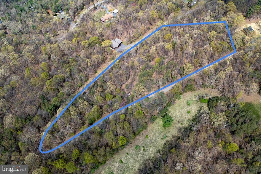 Welcome to the secluded and well-maintained Holiday Hill Subdivision! Lot B5 would be a perfect location for a dream home with its beautiful mountain views with 5.22 acres to spread out and enjoy.  This wooded lot has two sites suitable to serve a 3 bedroom house (paperwork on file.) This lot is a great getaway location and has endless possibilities, including investment options such as creating a Shenandoah Valley vacation rental, or a secondary residence to enjoy all year long! Historic town of Luray located just 10 minutes away with shopping, restaurants, wineries and the famous Luray Caverns!