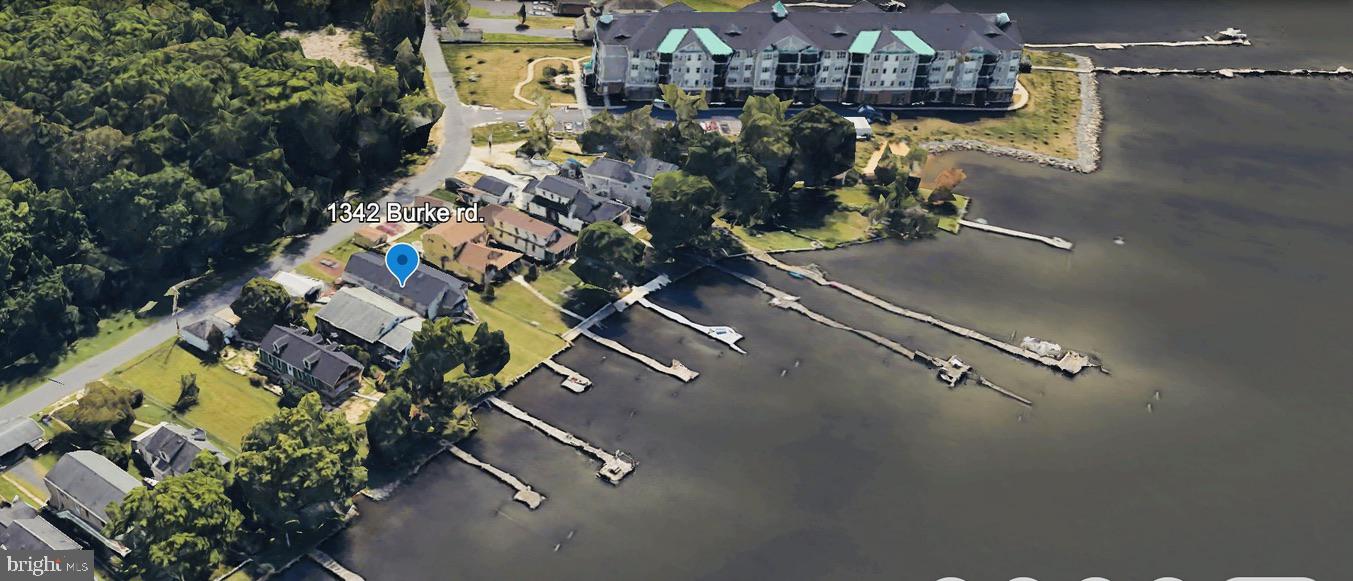 Bowleys Quarters "Spectacular Waterfront Living" Large Rancher (Lexington Model) w/ 9ft. ceilings. Ground level living at its finest, 3- full bedrooms 2- full baths 2- car oversized attached garage 30X20 w/ floored attic for storage. Street entrance has covered lighted walkway w/ pond, landscaping and a covered 11X13 deck at the rear (street) door. Enter into the 13X33 living rm/dinning rm combo area with all (Pella) upgraded windows for plenty of natural lighting. All three bedrooms are generous in size the Primary bedroom is 12X20 including ensuite bath, w/French doors that lead to the huge waterfront 20 X 12 family room addition that has cathedral ceilings & lg. bay window for scenic views. Off the dinning room area the front door leads to the waterfront entrance via maintenance free decking & stairs, w/vinyl banisters. Kitchen has beautiful Granite counter tops, Stainless sink, Hickory cabinets, New Frig, ceramic flooring, a wood stove & recessed lighting. Off garage entrance there is laundry rm & pull down stairs to floored lighted attic. **High lights are 3/4" hardwood flooring, lighted ceiling fans, & recessed lighting throughout. *Updates: New Carrier Heating/AC 2014, New water heater2022, New Roof 2020, New frig 2024, Newer wash/dryer, Newer wood stove, New grinder pump 2022. *For boating a 33 ft private pier w/ electric lift & plentiful wildlife, and scenic views. -Major commuter routes include I-695, I-95, Rte. 43, Rte. 40 and MD-702. **House has never flooded! *Property is ZONE X (500 YEAR ) flood = not in flood zone **panel #2400100445G (out of SFHA) WITHIN 250 ft of multiple food zones.
