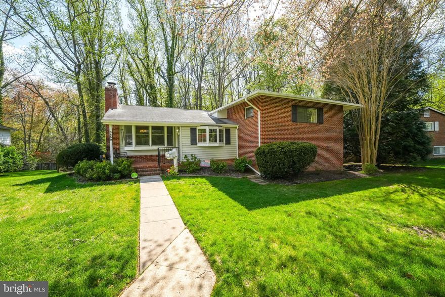 Available May 15th - This spacious 4-bedroom + bonus room, 2.5-bath home offers 2,900 sq. ft. of comfortable space and is situated on a premium .28-acre lot, backing to trees and featuring a private driveway. With 4 split levels, this home features hardwood floors on the main level, newer carpet on the second and lower levels, and two cozy  fireplaces (gas and wood-burning). The large kitchen boasts a new refrigerator and dishwasher, a large breakfast bar, ample storage and walk-in pantry, making it ideal for both cooking and entertaining. There’s also plenty of space with a formal living room and separate dining room. Step outside to a spacious deck with an awning, perfect for relaxing or dining, and a fenced backyard that backs to parkland, offering privacy and scenic views. The second floor features a spacious primary suite with a renovated bath, along with two additional bedrooms, a second updated full bath, and a large storage and linen closet. The expansive lower level offers a large rec room with a walk-out entry, a 4th bedroom, a bonus room, and a convenient half bath. Plus, there's a huge storage area with a laundry room.  Ideally located just minutes from shopping, dining, and major commuter routes including Arlington Blvd and 495, this home offers a great opportunity to live in the heart of Falls Church.