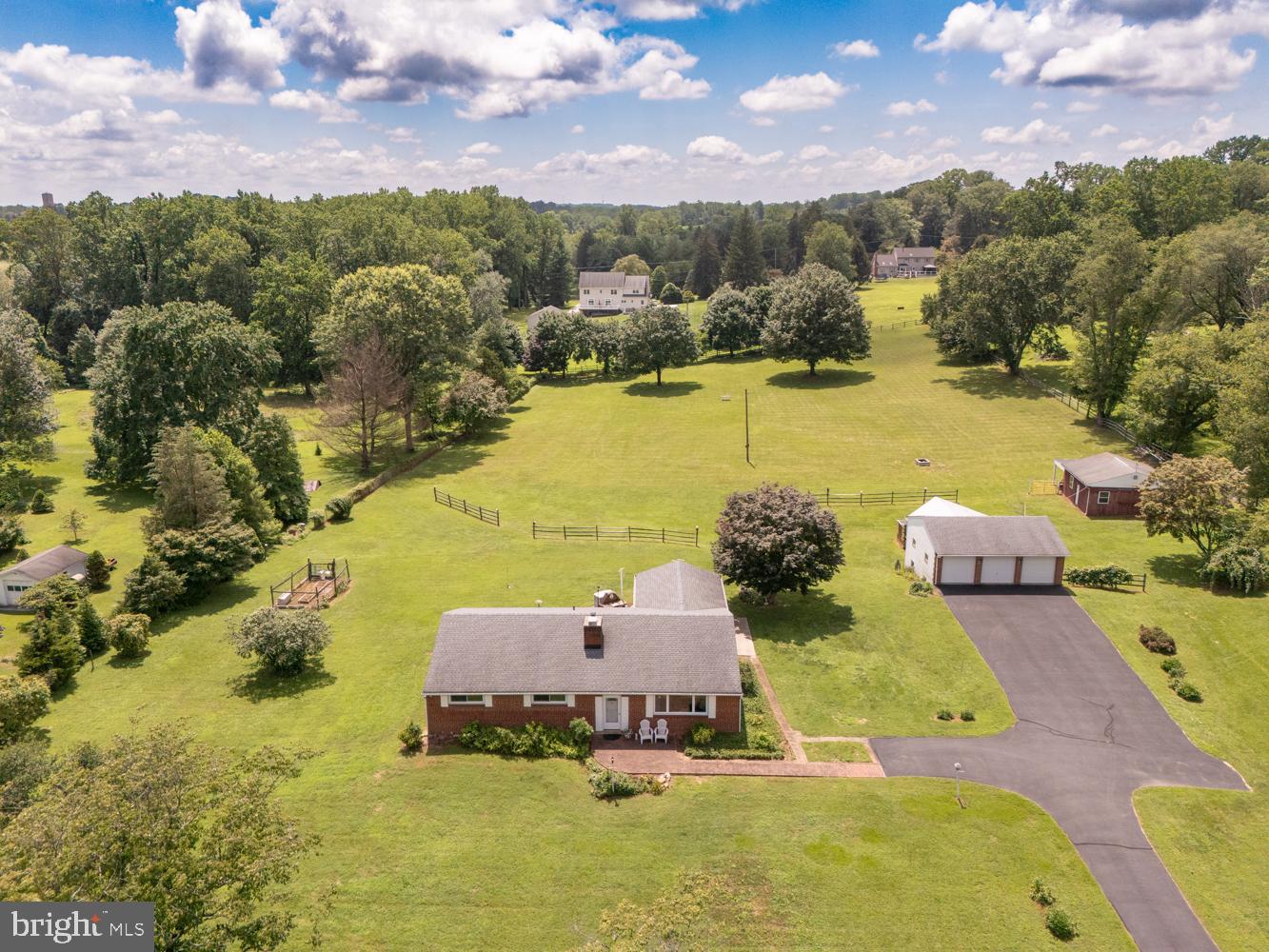 Well constructed all brick 3 bedroom 2 bath ranch on 4.25 acres on one of the nicest lots in Edgmont Township. 3 car oversized detached garage with 4 stall barn underneath. Separate structure ideal for a workshop or storage. Living room with newer hardwood floors and brick fireplace, Dining Room with hardwood floors, eat in kitchen with dishwasher & electric range. Family room addition on the rear with outside entrance to a really nice enclosed porch. You are going to love the views of your amazing lot! Primary bedroom with carpeting, two additional bedrooms with carpeting and well appointed hall bathroom. Central Air (newer) New roof in 2018 and newer windows. Full basement. This lovingly maintained home is perfect for those who love the outdoors and desire privacy on a large spacious lot. Sought after Rose Tree Media School District. Wilson Avenue and Forest Lane are two of the quietest most desired streets in Edgmont Township. The kids can ride bikes and evening walks will be a pleasure. Enjoy peace and quiet but yet be 15 minutes to downtown Media and 10 minutes to the Granite Run Mall. If location is everything, look no further!