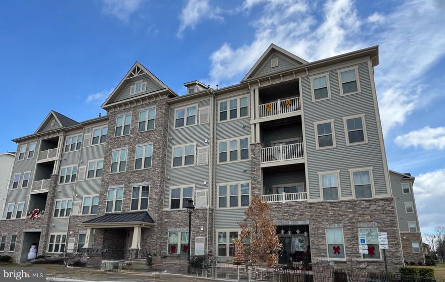 ***BEAUTIFUL ELEVATOR BUILDING IN SOUGHT AFTER OAKDALE VILLAGE***WELCOME TO THIS LOVELY IMMACULATE & GENTLY LIVED IN 2 BEDROOM & 2 BATH 2ND FLOOR CONDO***BUILT IN 2019, THIS OPEN FLOOR PLAN IS PERFECTLY LOCATED AND BOASTS NEARLY 1500 SQUARE FEET OF COMFORT & BEAUTY***VERY SPACIOUS LIVING ROOM WITH TV WALL MOUNT, LOTS OF WINDOWS, A DINING ROOM & A BONUS FLEX SPACE, IDEAL FOR AN OFFICE AREA***GOURMET KITCHEN WITH LARGE ISLAND WITH SEATING, GRANITE COUNTER TOPS, STAINLESS STEEL APPLIANCES INCLUDING A BUILT IN MICROWAVE, RECESSED LIGHTING & BRAND NEW LVP FLOORING***WALK IN CLOSET OFF FOYER***MAINTENANCE FREE BALCONY WITH COMPOSITE DECKING***CONVENIENTLY LOCATED ACROSS THE STREET FROM THE BRAND NEW WEIS & MANY OTHER SHOPS & RESTAURANTS COMING SOON,  ENJOY FRIDAY NIGHT LIGHTS AT OAKDALE HIGH SCHOOL & ALL OF THE COMMUNITY EVENTS LAKE LINGANORE OFFERS INCLUDING SUMMER CONCERT SERIES, FALLFEST, HOLIDAY CELEBRATIONS, 4 LAKES, 4 SWIMMING POOLS, 2 SANDY BEACHES, 2 COMMUNITY DOCKS, PICKLEBALL COURTS, VOLLEYBALL, TRAILS, COMMON AREAS, TOT LOTS, BASKETBALL & SO MUCH MORE***CINCH HOME WARRANTY INCLUDED***