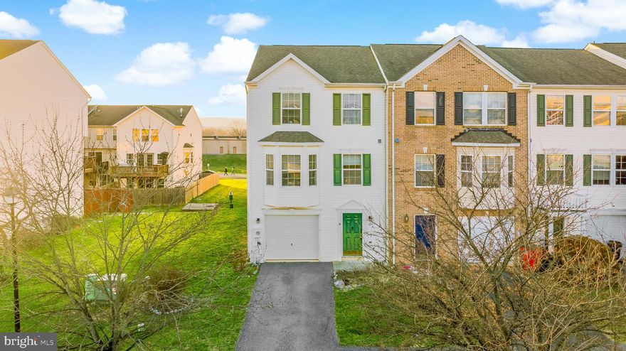 Welcome home to this spacious, 3 story end-unit townhome in the highly desirable Manor Park subdivision. 
Featuring 3 bedrooms, 3 full baths and 1 half,  the opportunities are endless with this property as it is one of the larger floor-plans with just over 2,300 square feet. Entering on the first level you will find a full bathroom along with a living area that could potentially be a fourth bedroom. Up the stairs you will find an open concept layout with beautiful hardwood floors, spacious kitchen with island & breakfast nook, large separate dining area, and the living area that has been bumped out adding additional space/square footage. The main level also includes a half bath. The third level is where you will find the spacious master bedroom with ensuite bathroom, and two additional bedrooms with full shared bath in hallway. HVAC & hot water heater are less than 2 years old. Do not miss your chance to live in a great location central to all that Martinsburg has to offer, and easy access to 81!