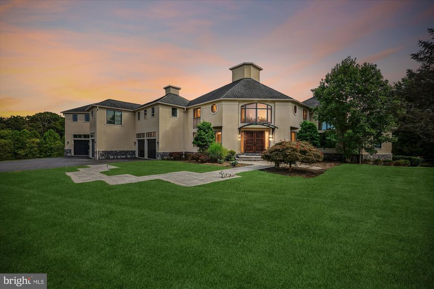 Discover an unparalleled opportunity to own a magnificent estate that redefines luxury living. Spanning an impressive 8,949 SF, this exquisitely unique home underwent major & complete renovations in 2012. Redesigned & built by award winning architecture Marc Mcinturiff, adding more square footage, an inground pool & a separate accessory studio building. Seamlessly blending contemporary elegance with timeless charm, this elegant property is a canvas for your imagination, offering limitless potential for customization & personalization. A truly bespoke living environment tailored to your desires with all the amenities, views, and vistas to match.<> The exterior showcases a stunning combination of stucco and stone, creating a striking façade that captivates from the moment you arrive. Set on a sprawling 2.83-acre parcel, the property offers unparalleled privacy and tranquility, backing onto lush parkland & mature trees. Multiple balconies, decks, and expansive patios invite you to bask in the beauty of your surroundings, while the heated in-ground pool & spa provide a luxurious retreat for relaxation & entertainment.<> Stepping through the distinguished, double, carved Borano Mahogany doors, you are greeted by a magnanimous open layout that effortlessly blends elegance with functionality. The grand foyer, adorned with its two-story soaring ceilings, sets the tone for the sophisticated ambiance that permeates throughout the home. Natural light floods the space through purposefully & abundantly placed windows, creating a warm and inviting atmosphere that is perfect for both intimate gatherings and lavish entertaining. The interior boasts five/six spacious bedrooms and seven & a half bathrooms; each designed with the finest finishes. The heart of the home, a gourmet kitchen, is well-appointed with granite countertops, a distinctive center island & breakfast bar, double convection ovens, and a 6-burner Viking range perfect for culinary enthusiasts. The open-concept layout flows effortlessly throughout the substantial living spaces, with room & freedom for all your needs. The 2-story family room features nearly full-wall windows on both sides for an open, light-filled & inviting atmosphere. The adjoining office/library, with its peaked-octagonal ceiling, features efficiently integrated, double, 8-foot-frosted-glass sliding doors with concealed flawless tracking & framed with a full-length glass transom overhead. <> Additional features of note are the Mercier engineered hardwood floors; the huge, fully customized, walk-in bedroom closets; heated flooring in both the owner’s bath and the lower-level pool bath; a whole-home Kohler 20KW Generator; & the whole-home, integrated SONAS sound system with in-ceiling & in-wall speakers. The lower level, with its stone, (2nd), fireplace & triple set of sliding glass doors to the outdoors, also includes multiple storage, utility & workshop areas plus a cedar closet and possible future wine room. A future wet bar is roughed in for a 9' bar, full sink, fridge, 2 wine fridges & dishwasher. Outside the heated inground pool is complimented with a triple-fountain feature, outdoor speakers, & a separate, heated, spa/hot tub with its own waterfall feature. The expansive patio includes a rough-in propane line for your future firepit lounge. Not to be left out is the separate accessory studio building with an office, studio area, full bath, 4th garage in front and 5th “landscaping garage” in the rear. This studio also includes plans for a moderate kitchen to augment its living quarters. <> With its breathtaking views, this residence is not just a home; it's a lifestyle. Experience the perfect blend of luxury, comfort, and nature in this exceptional property, where every detail has been thoughtfully curated to offer an exclusive living experience <> Come embrace and enjoy a life of elegance, sophistication, and extraordinary comfort reflecting your unique vision & lifestyle!