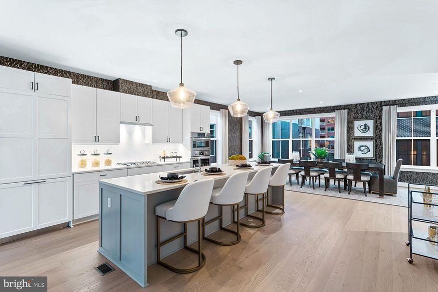 CLOSE OUT PRICING!! Previously priced at $2,899,900, this is a RARE OPPORTUNITY to own a BRAND NEW CORNER UNIT Townhome with Elevator at VENUE. Built by renowned local developer, Carr Companies, the finishes in this development are extraordinary. Equipped with a luxurious chef's kitchen featuring panelized Thermador and stainless steel Bosch appliances, built-in wine cooler, Quartz countertops, custom soft-close cabinet drawers/doors, white oak hardwood flooring throughout,  and an in-unit elevator providing easy access to all floors. This light-filled, corner unit townhome offers 4400 sq ft, has three large bedrooms, three full baths, PLUS two half baths, a gigantic office space, two extra den spaces, a sizable family room loft with direct access to the rooftop terrace, and a massive garage with 12 ft ceilings featuring an Electric Vehicle charging hookup.  All bedrooms include large walk-in closets, offering an abundance of storage within this townhome. The private roof terrace is equipped with a gas line, plumbing line, and electrical so the entertaining possibilities are endless! Enjoy charming views of our neighboring park from the rooftop terrace. VENUE is the ideal location in Old Town's most desirable neighborhood, right in the center of entertainment, restaurants, and shopping, just moments away from King Street, GW Parkway, and the Potomac River with direct access to the Mount Vernon Trail. This is a MUST-SEE TOWNHOME!! Immediate occupancy is available. Come see what all the fuss is about!
*Photos from when the unit was a model previously*