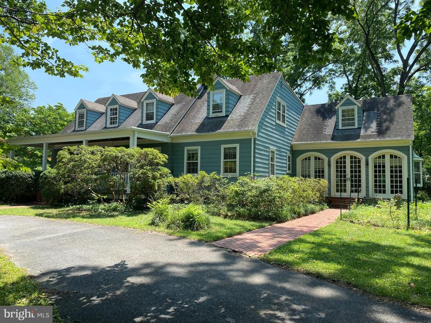 Fantastic opportunity for anyone wanting to renovate and remodel. This hidden gem presents many possibilities for the buyer looking for a sizable premium lot. Plenty of room for a pool and a pickle ball court. The house is quite charming and features a desirable traditional floor plan with a very spacious eat in kitchen with big island as well as a large family and conservatory room with beamed ceilings and incredible doors to the outside. There is a main level bedroom and full bath. The upstairs bathroom is enormous and offers a terrific opportunity to redo to your liking. The covered front porch will delight you as well as the wrap around driveway. Many architectural attributes abound like the beautiful stairs, dentil crown moldings, French doors and bay windows, fireplace hearth, and hardwood floors throughout. The rear deck overlooks the grounds and is perfect for entertaining. There is a terrific, screened porch too. There is another garage that is accessed from the rear of the house which could be perfect for someone that restores old cars or just needs some extra project space. Bring your vision and your love for this location, which is close to the by membership Garrett Park Pool, Kensington, Downtown Bethesda, NIH, Walter Reed, Pike and Rose, and major commuting routes.