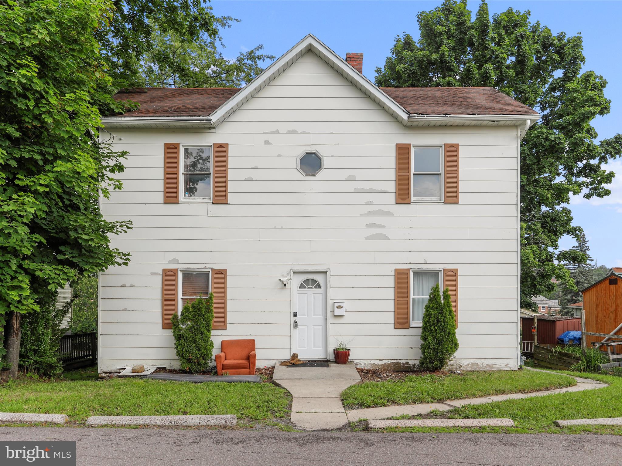 $15,000 price improvement!!! Great home located within walking distance to the Frostburg campus. The main level offers a large bedroom, a half bath, living room, mud room and kitchen. Upstairs you will find 3 more large bedrooms and a full bath. An extra bonus is you can walk out the back sliding glass doors and look at the beautiful Frostburg State University campus. Close enough to keep your cars at home and walk over for any Frostburg event. There is plenty of parking in the rear of the home. It is also just minutes away from downtown Frostburg which offers many shops, restaurants and night life. The roof is less than 5 years old!! Come take a look and you won't be disappointed. Home being sold As-Is.