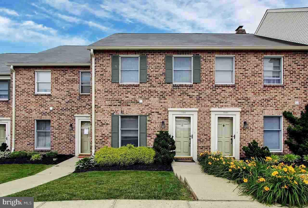 Enjoy the benefits of condo living! This cute all brick condo has eat-in kitchen w/separate DR, spacious LR that leads to rear private patio. 2 spacious bedrooms on 2nd level, each w/it's own private bath! 2nd floor laundry. Half bath on 1st floor. Off-street parking lot. Convenient location- right in Dallastown & close to I83! The ultimate in carefree living!