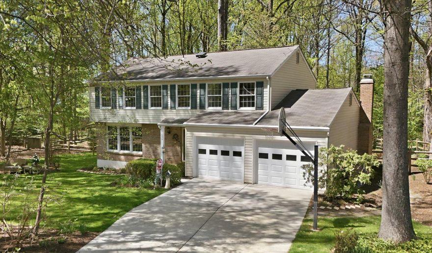 Discover the space, setting, and lifestyle that Reston is known for in this charming colonial nestled among mature trees. Thoughtfully designed for everyday family living, this home offers four spacious bedrooms, two full baths, and a comfortable layout with room to grow. The inviting family room, anchored by a classic brick fireplace, flows seamlessly into the dining area—perfect for gatherings, holidays, and relaxed evenings at home. The updated kitchen features granite countertops, new stainless steel appliances, and new backsplash to show off your cooking skills. Sunlight fills the home through large patio doors, highlighting hardwood and durable vinyl flooring throughout. Upstairs, the primary suite provides a private retreat with a beautifully updated glass walk-in shower and generous closet space. A partially finished daylight basement adds valuable flexibility—ideal for a playroom, home gym, media space, or additional storage. Set on a generous 0.36-acre lot with front, side, and rear yard areas that backs to trees, the outdoor space offers room for kids, pets, and entertaining. Enjoy everything Reston has to offer, including scenic lakes, pools, tennis courts, trails, and community centers that support an active, family-friendly lifestyle. Updates include fresh interior paint, new stainless steel kitchen appliances, new HVAC compressor, recessed lighting, granite countertops, and an upcoming installation of $70K in Andersen Windows—a major value add for comfort and efficiency. Complete with a two-car garage, ample driveway parking, and easy access to major commuter routes, Metro, and shopping destinations like Reston Town Center and nearby retail hubs, this home offers the perfect balance of tranquility, convenience, and long-term potential.