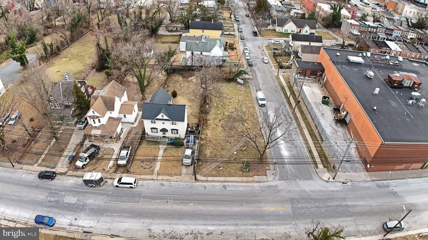 Corner lot land offering in Baltimore with frontage on Woodbourne Ave, providing flexibility for new construction with room to accommodate a single-family residence along with front and rear yard areas. The corner positioning allows for multiple design options, access points and natural separation from neighboring parcels, making it an attractive site for future homeowners or investors. Situated in an established city neighborhood with easy access to a variety of Baltimore attractions, this location offers proximity to Baltimore’s Inner Harbor, home to waterfront dining, shopping, historic ships and seasonal events, and the world-renowned National Aquarium. Enjoy panoramic city views from Top of the World Observation Level, explore historic maritime streets in Fells Point, or visit local nature and garden favorites like Sherwood Gardens and Lake Roland Nature Council. With access to urban parks, cultural destinations, dining and entertainment throughout Charm City, this land presents a compelling opportunity to build a home within reach of vibrant city life.