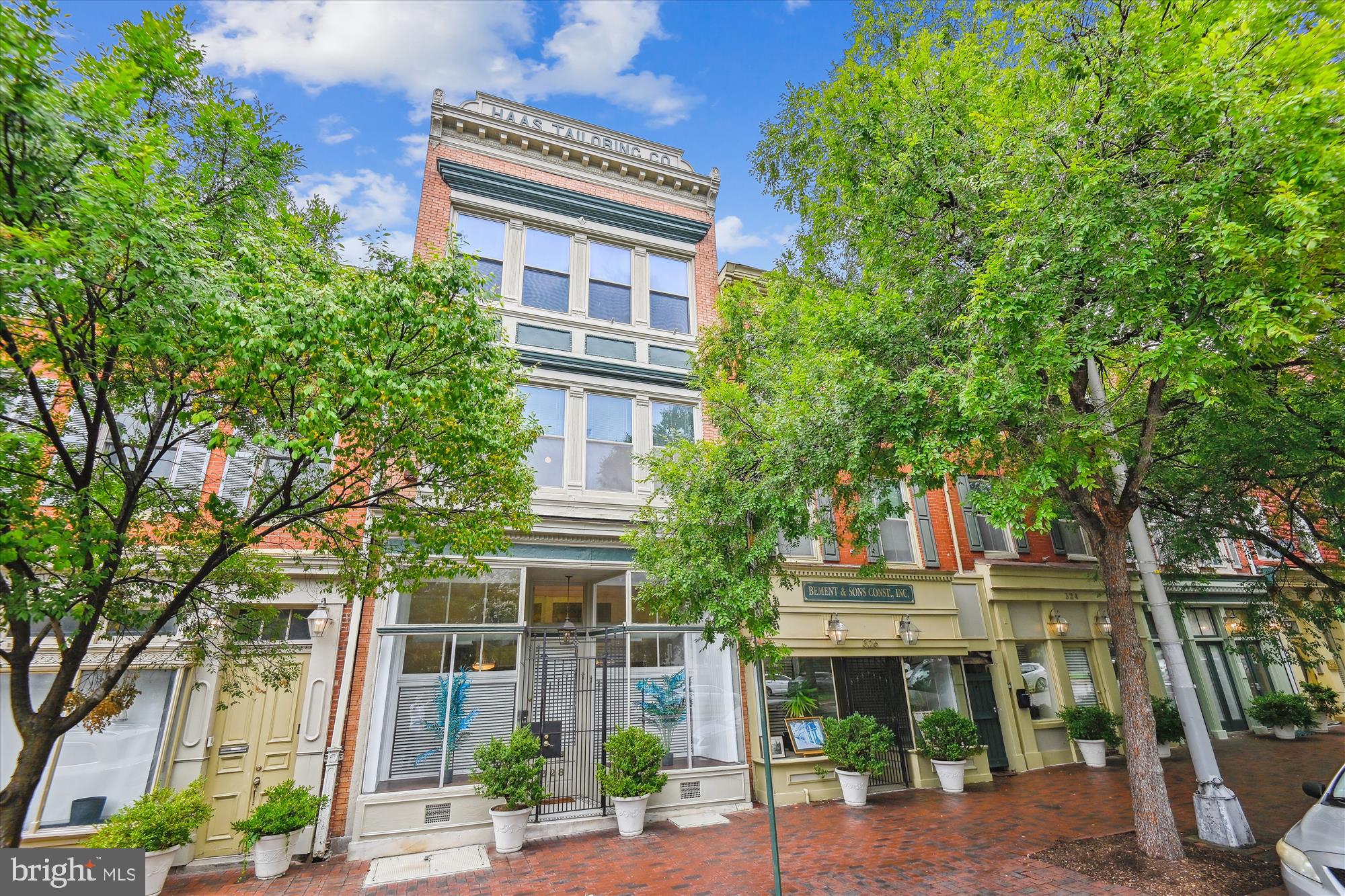 Step into Baltimore's oldest historic neighborhood and discover this one-of-a-kind residence in coveted Fell's Point Historic District. This extraordinary property seamlessly blends industrial heritage with modern living. Originally built as the tailoring workshop of German immigrant Jacob Haas (1897), this former sewing factory produced custom suits that helped define Baltimore's fashion. Today, this 4 bedroom / 3 bath home seamlessly blends industrial heritage with residential sophistication. Architectural elements from its factory days remain proudly intact: glass block floors filter natural light across multiple levels. The original freight elevator, once used to move bolts of fabric between bustling sewing rooms, has been replaced with a residential elevator to access floors with ease. Soaring tin ceilings and open layouts harken back to the ingenuity of the industrial revolution, offering grandeur and character. Part of a 6-unit HOA development known as Tailors Row, you will enjoy this 4100+ sq ft unique NY loft-style property with a dedicated parking space( a Level 1 charger can be installed), situated along a tree-lined boulevard leading to the market square and water edge, with charming side streets along the way. Rich Fell's Point maritime history is at your doorstep with easy access to Harbor East shops and dining. This is a lifestyle investment in Baltimore's living history. Perfect for buyers seeking character, authenticity, and the irreplaceable charm of a bygone era. Prime location, 5 blocks from the water and 5 blocks from the Johns Hopkins Medical Campus.
…