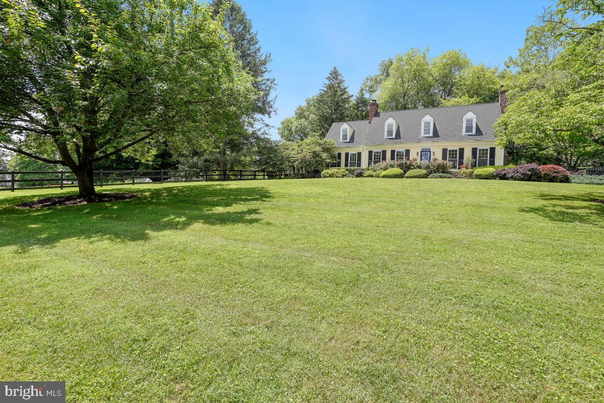 EXCEPTIONAL POTOMAC ESTATE** TAKE A MAGICAL JOURNEY TO THIS ENCHANTING WONDERLAND !**Truly a unique offering & EXPERIENCE! A nature lovers delight- your own private oasis! Vintage charm meets the modern! Stately, classic 4 bedroom/2.5 bath center hall Williamsburg Colonial beauty, ideally sited atop hill on a spectacular 2.5 acre lot boasting an east/west orientation! Stunning sunrises, dramatic sunsets! Interior spaces flow interchangeably as the fabulous and "traditional" floor plan is perfect for daily family living and equally superb for spirited gatherings & large group entertaining! MAIN LEVEL: Generous main floor living spaces flow with ease making the home feel unified, spacious and grand. Loads of natural light throughout! Elegant living room, GRAND dining and warm, cozy family rooms all w/ wood burning fireplaces, transition beautifully and offer great living space. High ceilings, crown & chair rail moldings, newly refinished gleaming oak hardwoods, terrazzo and marble tile & updated windows adorne this residence. The glorious Chef's galley kitchen complete w/ high end appliances and finishes include Viking, Thermador and Kitchenaid, granite counters, recessed lighting, butlers bar and special custom designed millwork cabinets. Three stunning wood burning fireplaces, built-ins, multiple double french doors (many leading to outside spaces) and a breakfast nook. The gem on the crown is the AMAZING "three season" porch just off the family room! Guaranteed to be a popular gathering place for family & friends! UPPER LEVEL: Exceptionally large private owners suite & full bath w/ tub, loads of closet/storage space. Three additional large bedrooms and second updated full bath. LOWER LEVEL: Fully finished walkout lower level complete w/ dramatic full sized "custom wood crafted" wet bar & Tiffany styled lighting, new berber carpet, recessed lighting , wash room and additional storage. These are just some of the exceptional features of this fine and distinctive property. EXTERIOR SPACES: Hardieplank siding w/ dental moldings and architectural engineered cedar shake roofing. The crowning jewel of this fine property is its spectacular outdoor spaces! A long private tree-lined driveway gives you the feeling that "you have arrived"! Vista views abound from every vantage point within the 2.5 acre lot! The professionally and gloriously landscaped spaces are a gardeners delight! Enchanted Garden! Teaming with a myriad of plantings and pathways, the garden beckons you! Partially treed, partially fenced with an abundance of open grassland! The expanded flagstone terrace leads you to a sumptuous inground pool, ideal for relaxing and having fun on those endless summer days! The upper lot boasts a Amish built storage shed and large fire pit area, perfect for gathering on those cool Autumn nights! LOCATION: Close to amenities including schools, shopping, Potomac Village and I-270. This indeed is a most special offering!