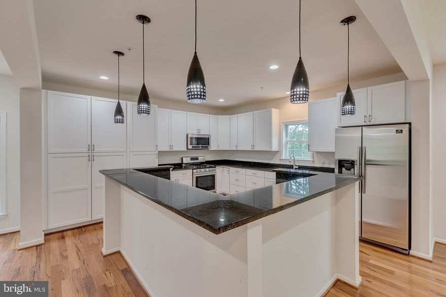 As you drive down your country style driveway the tall trees on your left can tell the history of the area.   Tucked away from the street, yet having the benefit of friendly neighbors nearby, you will enjoy the 1.69 acres of serenity. A gracious 2 story foyer with marble flooring greets you as you enter. Gleaming hardwood floors flank the main and upper levels and the lower level features easy to care for vinyl planking.  The living room features a bow window with view of the protected woodland that you call your front yard.  Enjoy the open floorplan and easy flow of your new home.  The gourmet kitchen is truly a focal point in your home.  Featuring 48 in cabinets, a corner island, granite counters and of course stainless appliances. Your formal dining room has a lovely view of the peaceful rear yard.  The sliding doors are already in place, should you choose to add a deck.  Moving through the main level, you will find a full bath and a room that could be a first floor bedroom or a wonderful office.  What a dream to have in this work from home environment!    Enter the 2nd level from the foyer or from the dining room!  The all wood steps are a show stopper!  Upstairs, you will find your 19 X 21 primary suite, featuring dual walk in closets and a luxury bath.  Additionally, there are 3 generous sized bedrooms and the laundry room.   Boasting over 5100 finished square feet, there is so much more to discover, so come by and see for yourself.  This home is 2 years old, but you will be the first to live here! Enjoy not having the rules of an HOA.  Just a short drive from DC, Baltimore or Annapolis.   What a relaxing atmosphere to come home to.  Property taxes are estimated. The seller is currently out of the country, so taking care of the final finishing touches will be difficult for him.  He would prefer that you take care of them.  All offers will be reviewed as they come in.  However a final decision will probably not be made until the home has been on the market for 7 days.