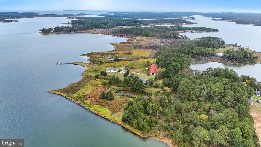 Escape to this rare waterfront retreat on Brooks Creek in Cambridge, offering Two Thousand ft of water frontage with sandy beaches, Private pier and Pond. The property features a Four Bedroom, Two and One half Bath Colonial-style main home plus a Three Bedroom, Two Bath guest house with great potential. Enjoy a large barn, pond, and multiple outbuildings, ideal for hobbies, storage, or fishing. With serene views, abundant space, and endless opportunities, this property blends waterfront living with country charm.