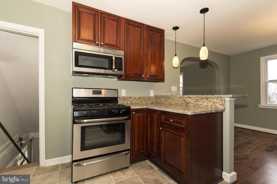 Impressive renovation from top to bottom. Sale also includes extra .24 acre adjacent lot!  All new granite counters, kitchen cabinets and stainless steel appliances.  All new hardwood floors on main level, carpet on upper level, bathroom tile, vanities, windows, furnace and rear deck. Easy access to Rt 695. Come see it today!