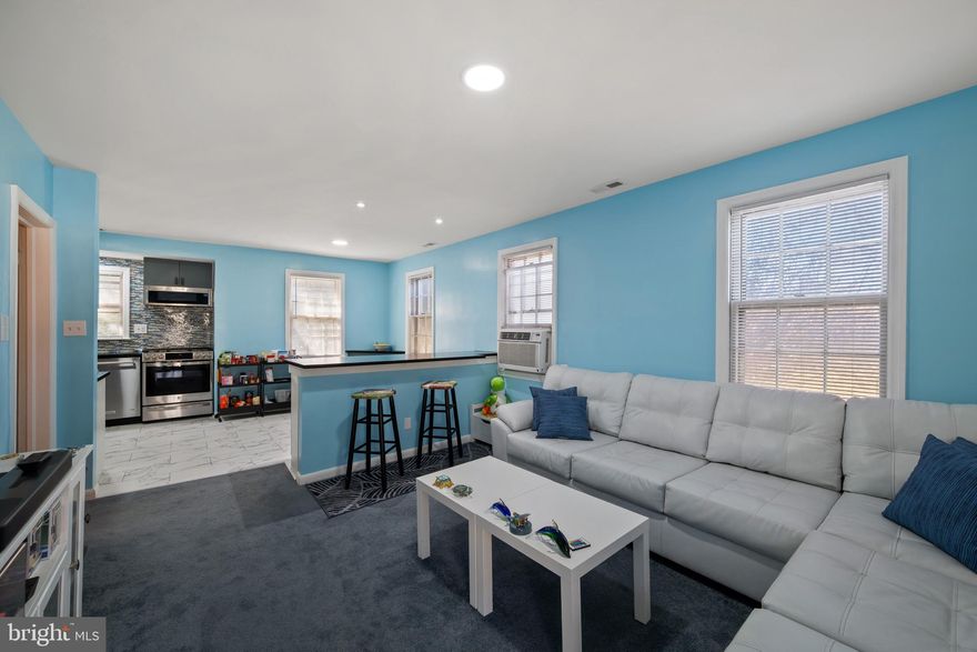 Charming and cozy rancher-style home offering comfortable one-level living and an open, inviting layout. This home features 2 large bedrooms and 1 beautifully updated bathroom, along with a modern kitchen with stylish finishes and a large bar. Enjoy the flexibility of two spacious living areas, including a stunning living room with a vaulted ceiling and exposed brick that brings out the character! A dedicated office space provides the perfect setup for working from home or a quiet study area. The open layout creates great flow throughout the home, making it ideal for everyday living and entertaining. Additional features include a garage and private driveway for convenient parking. Located close to major commuter routes, shopping, and restaurants, this home combines charm, comfort, and convenience in a great location.