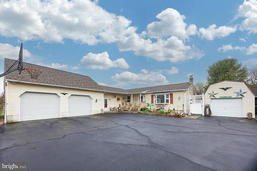 The ultimate property for storage, entertaining, and multi-generational living. Perfectly designed for those who need space for vehicles and equipment. Storage galore: Oversized 2-car garage with extra space for tools or a workshop, it even has stairs to a 25 x 12 floored attic above. Massive 40 x 12 detached garage complete with an attached carport- ideal for boats, trailers, or extra vehicles. Separate 12 x 20 tractor shed. Perfect for storing larger equipment or seasonal gear, attached wood shed. Pull up on the oversized driveway; there is so much extra parking! Inside, you'll find a semi-open layout that includes a large living room, dining area, and kitchen, along with a generous family room addition that opens directly to the back patio. The primary bedroom features an ensuite full bath. A second traditional bedroom and a hall bath. A private in-laws suite offers its entrance, kitchenette, half bath, and open space for bedroom and living use-perfect for extended family or guests. Finished basement includes a huge bedroom with a toilet, a game room, and a laundry room. Out back, enjoy a covered patio kitchen, what a great vibe!  Whether you love entertaining or just want a spot to unwind, this backyard has you covered.  Surrounded by gardens. Super cute potting shed, the outdoor space completes the package. There is so much flexibility in this space, bring your vision and make it your own.