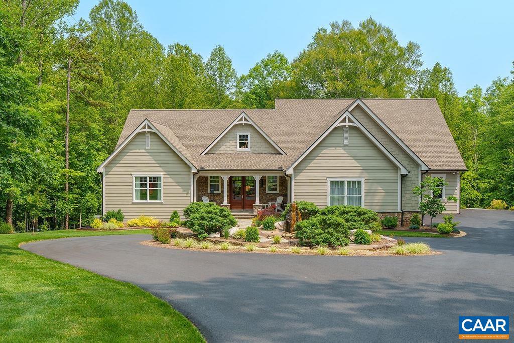 Nestled in the leafy, spacious community of Proffit Ridge, this immaculate two-year old custom home features unrivaled craftsmanship. Perfectly sited on a lot of just over 7 acres, the home rests at the end of a cul-de-sac, providing a sense of rural sanctuary while being just minutes shopping and restaurants. A total of five bedrooms: primary suite & additional ensuite on the main level, two bedrooms on the upper level, and fifth on the basement level. Each floor features common spaces: a living room and large screened porch on the main, loft living room upstairs and an expansive rec room with sunroom downstairs. The gourmet kitchen includes a large island, induction cooktop, convection oven, and walk-in pantry. Primary suite includes a spa-like bathroom with walk-in shower, Jacuzzi soaking tub, dual vanities, water closet, & custom walk-in closet. Basement level features home gym, craft room with exhaust, & walk-out to a back patio and rear of the property. The oversized garage has ample parking for 2 vehicles and a bay for a mower or ATV. Whole house generator. The solar panels provide an excellent reduction in utility costs. 15 minutes to the Downtown Mall & UVA, 8 minutes to the airport.,Quartz Counter,Fireplace in Living Room