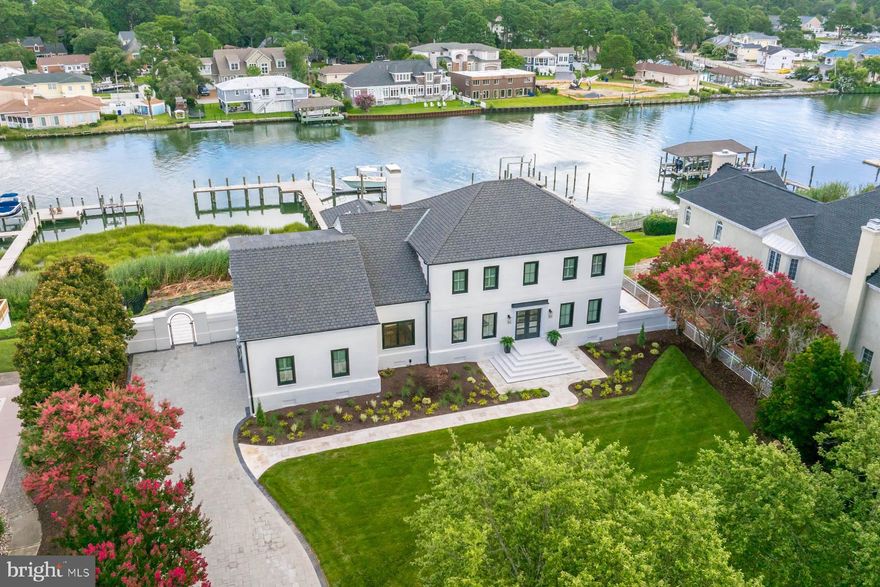 A true dream home w/ renovated interior & entirely new exterior just completed & ready for you! Stunning lotpositioned on a ridge high above Long Creek w/ breathtaking views of Broad Bay. New pier, floating dock, boat lift &railings. Interior feat. an amazing layout w/ expansive kitchen incl. quartz countertops & high end finishes throughout.New Pella floor to ceiling windows & doors across the back of the house providing amazing natural light & incredibleviews of the water. 2 primary suites, one on the 1st level & one on the 2nd. Spacious guest rooms & an expansivebonus room over the garage w/ wet bar & full bath. An ultimate waterfront retreat w/ white travertine pavers, resort-styled pool & spa w/ new equip. all completed 2025. Cabana bar w/ pool bath. This backyard has it all! Other updatesincl. expanded paver driveway, landscaping, ext. lighting & more! Perfectly located in one of the most desirable GreatNeck neighborhoods, just minutes to the Bay beaches & restaurants..