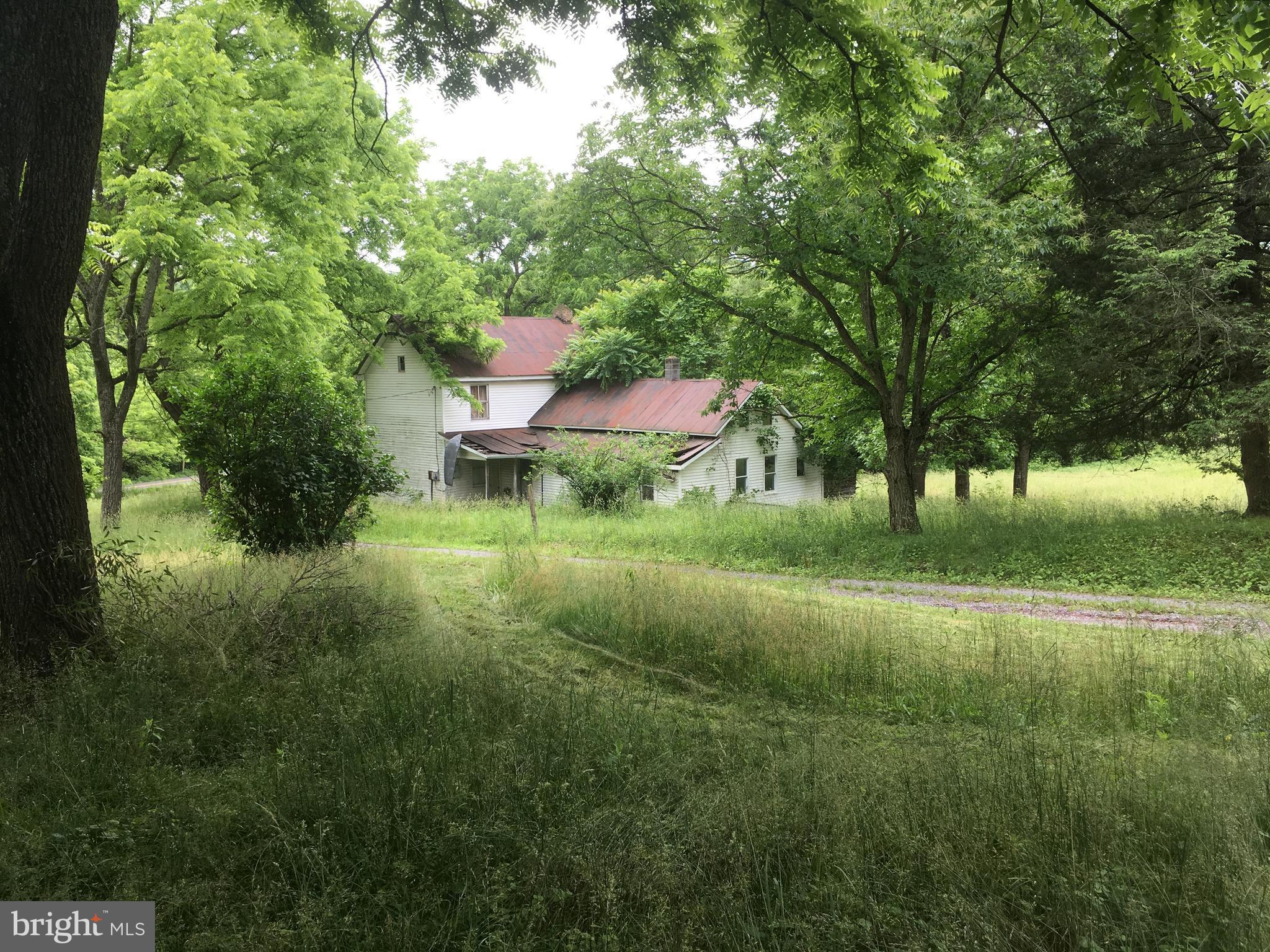 17.275 acres of beautiful & peaceful land with several structures that can be completed to serve your needs. Come look at the unlimited possibilities. Property is being sold AS-IS.