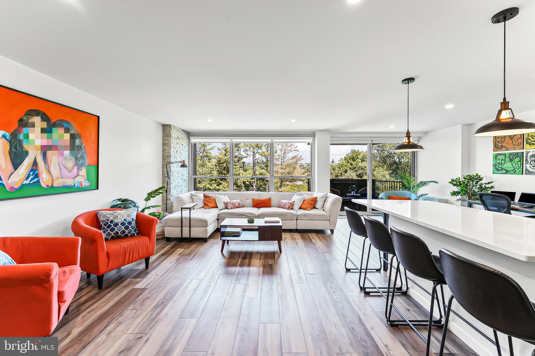 Experience refined living in this thoughtfully renovated two-bedroom, two-bathroom condo at The Green Hill, where modern upgrades and serene surroundings create the ultimate retreat. This home features an open floor plan with a beautifully renovated kitchen that includes a large peninsula seamlessly connecting to the living and dining areas, perfect for both everyday living and entertaining. Designer lighting and upgraded electrical service enhance both style and functionality throughout the space. The kitchen is a true showpiece, offering stainless steel appliances, quartz countertops, and timeless shaker cabinetry. Both bathrooms have been completely transformed with new tile, vanities, sinks, toilets, hardware, and fixtures, creating a spa-like atmosphere that feels fresh and sophisticated. Generous closet space throughout the home, along with a full-size in-unit washer and dryer, adds convenience and organization. Residents of The Green Hill enjoy 24-hour gated security and an array of resort-style amenities, including indoor and outdoor pools, a fitness center, tennis courts, walking trails, a playground, shuttle service, and vibrant social spaces. The HOA fee covers all utilities, offering a truly effortless living experience. Situated within the award-winning Lower Merion School District and just minutes from shopping, dining, public transportation, and Center City Philadelphia, this home perfectly balances elegance, comfort, and convenience.