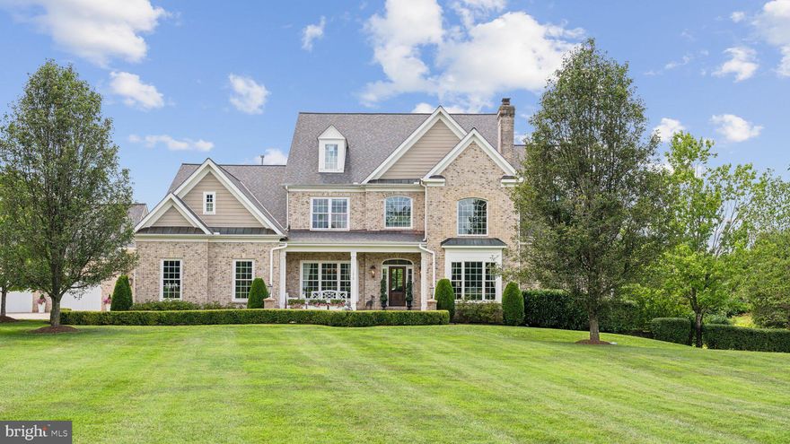 Nestled in the heart of Nokesville, 13840 Jordan Meadows Lane epitomizes luxury living in Northern Virginia. This meticulously maintained “all brick” home offers an unparalleled lifestyle, boasting a wealth of upgrades and amenities designed for comfort, convenience and entertainment. Set on ten private acres within a small community where neighbors enjoy a close-knit atmosphere without any governing HOA. 

You'll be greated by a flagstone patio and welcoming front porch. The majestic foyer will set the tone for the rest of this unique home. On your left, the formal dining room with an elegant chandelier, and on your right you'll find the library with cozy fireplace surrounded by 2-story built-ins for your books and treasures. Step into the gourmet kitchen, a chef's delight, featuring granite counters and island, a Subzero refrigerator, a Thermador gas range, a beverage station and a plethora of storage. Whether hosting a casual brunch or a lavish dinner party, this kitchen is sure to impress.

Spectacular outdoor living spaces including a paver patio with a built-in fire pit, lush landscaping, retaining walls and a fully stocked pond with 3 submersed aeration units and a second well. An in-ground pool, a pool house and an all-brick pizza oven are all part of this perfect set-up for social gatherings and relaxation.

Inside, the professionally designed and furnished home boasts such architectural details such as wood floors, boxed ceiling in the family room and owners’ suite, and extensive custom millwork and moldings throughout resulting in an inviting atmosphere for residents and guests. The owners can appreciate main level living with an incredible owners’ suite that includes a 2-story walk-in closet, and a spa-like owners bath, luxurious marble floor and jetted tub and main level laudry room.

The upper level offers a princess suite with private bath and a balcony overlooking the pool and pond. 2 additional bedrooms share a hall bath. There is also a "bonus" room for crafting, reading, etc. 

The walk-out lower level extends the living space with a finished recreation room, perfect for movie nights or gatherings. There’s an additional in-law suite with a bedroom, a sitting room and a full bathroom, ideal for guests or as a private retreat.

The newer building has its own air/heat and can host 12 vehicles comfortably as well as a separate workshop with hydraulic lift and half bath. 

The list goes on, please refer to the “list of features” (coming soon) for a comprehensive list of all improvements and upgrades.

13840 Jordan Meadows where luxury knows no boundaries and every day is a testament to the art of living beautifully!