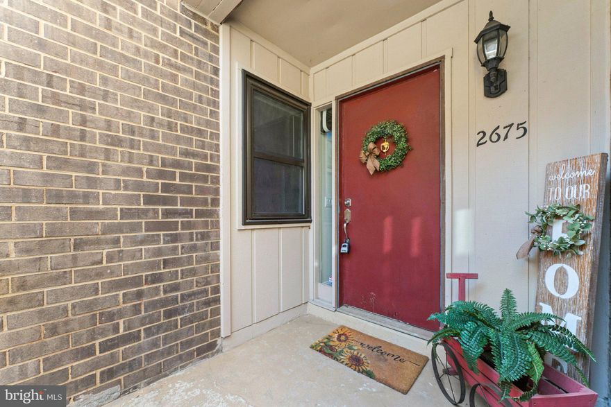 Price Improvement!   Cute and Cozy Updated Condo!  Welcome Home to this light-filled open-floor condo in the heart of Vienna!  This lovely 2-bedroom condo has been updated with luxury vinyl plank (LVP) flooring.  There are stainless steel appliances, a French-style refrigerator, a built-in microwave, a farmhouse stainless sink, butcher block countertops, ceramic tile, and a herringbone tile backsplash.  Both bathrooms have been updated.  The bedrooms have ceiling fans and LVP flooring, which are freshly painted, a walk-out level patio with a privacy fence to relax.  Water is included in the condo fee.  Realtors: Please review the agent's remarks before making an offer, including the assigned parking spot and additional visitor spots.