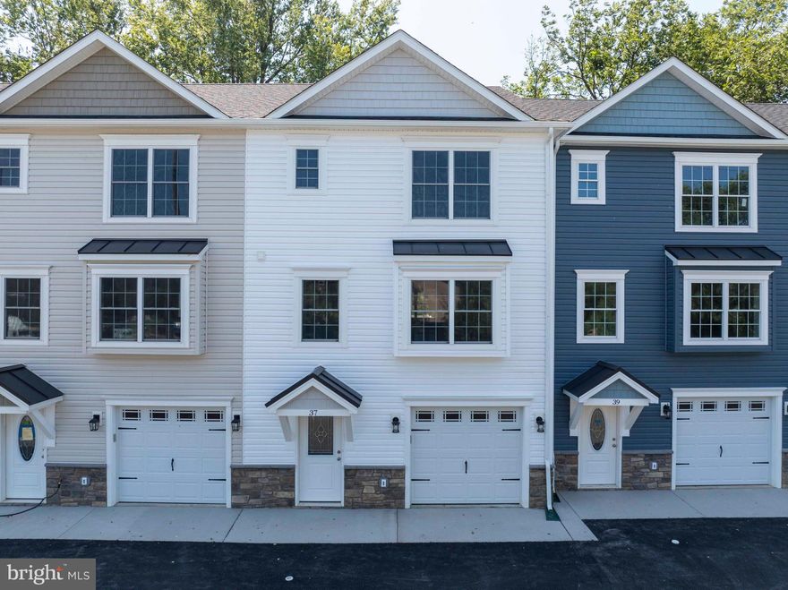 This luxury 3-level interior townhome is fully finished and waiting for its first owners! Featuring 3 bedrooms, 3.5 baths, a finished basement, a 1-car garage, and a spacious rear Trex deck, vinyl railings, with 6' vinyl privacy divider.  This home is perfect for both everyday living and entertaining.

📍 Prime Location: Just minutes to I-66 & I-81, shopping, restaurants, golf courses, and the Shenandoah River – plus only 20 minutes to Winchester!

✨ Features You'll Love:

Luxury vinyl plank flooring throughout

Gourmet kitchen with upgraded quartz countertops, stainless steel appliances & breakfast bar

Open-concept dining & living room with a cozy nook – perfect for a home office

Rear Trex deck, vinyl railing, 6' vinyl privacy divider perfect for entertaining or enjoying the outdoors

Owner’s suite with double-vanity bath & ample closet space

Two additional bedrooms & full bath on the upper level

Convenient upper-level laundry

Finished lower level with family room & full bath – great for guests or rec space

High-speed internet available – ideal for working from home

1-car garage, electric vehicle charging outlet in garage with extra parking available

No HOA 

This home combines modern finishes, functional living space, and a sought-after location. Don’t miss the opportunity to make it yours!