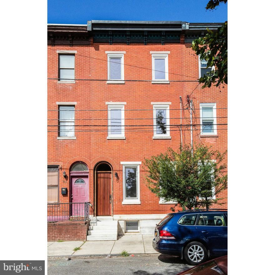 Looking for Style •  History • Modernism • Functionality • Elegance in an Environmentally Sensitive home with amazing outdoor spaces and onsite parking? 764 S 18th is the right place for you. Built to international Passive Home standards, this incredibly well-insulated historic row house equipped with triple pane windows and sophisticated HVAC will not only lower your carbon footprint, it will elevate your living experience with quiet, comfort, and a steady flow of filtered fresh air at a fraction of the monthly cost of conventional home systems. Enter the home through a contemporary, custom-made Australian Blackwood front door designed to fit the arched entry in the lovely mid-19th-century brick facade. A glass panel behind an upholstered bench and the tiled entryway floor create an open, welcoming foyer. The space then opens up to tall ceilings, natural light, white oak flooring, and a contemporary wood and steel staircase creating a voluminous living and dining area. The sight line at the entrance extends all the way through the home 98 ft to the rear of the property on S Cleveland Street, where the custom laser-cut driveway gates will soon be installed. The entrance to the kitchen is flanked by a custom blackwood coat closet. The kitchen floors are multi-colored slate tiles, the cabinets have Shaker lines with a variegated gray/brown finish, the counters are pale quartz, and the backsplash is augmented glass with stainless steel behind the stove. The rear of the kitchen is a wall of glass overlooking the patio and the parking and planting area behind. Currently in progress for completion prior to settlement are a permeable paved surface for parking, a bamboo-inspired laser-cut driveway,  and pedestrian gates. There are also defined planting areas in the works, including a wall of bamboo to the south and a variety of specimens to the north, which will also be completed before settlement. Heading down the oak stairs from the living room you will find an exposed stone foundation wall that highlights a large, open, beautifully finished space perfect for a media room, or given the well-appointed adjacent full bath, a 4th bedroom or guest suite. To the rear of this level is a large finished storage area, and a means of egress that opens to a lovely rock garden. Also on this level is a mechanical/technology closet with an abundance of features that are too long to list here. Back up the stairs and to the second floor you will find a pair of well-proportioned bedrooms. One featuring east light and views of the park across the street. The rear unit has a large corner window with west light and views of the patio. In between is a lovely white tiled bathroom with a combination soak tub/shower. Additionally, there is a laundry room with a stacked washer/dryer, sink, countertop, cabinets, and an area for air drying your delicate clothing. The lovely quarter-turn staircase illuminated by large windows rises to the 3rd floor where you will find access to a wonderful roof deck featuring ipe wood decking, a planting area, and frosted glass panels supported by white finish steel railings. Opposite the deck is a small flex space suitable for a modest-sized desk or chair featuring a fabulous view, but this area could also be enclosed to create a second walk-in closet to complement the primary one on this floor. Between the primary closet and east-facing bedroom is the primary bath with a glass shower stall, a large mirrored self-defogging medicine cabinet, and a floating vanity. Schedule your private showing to learn more about all of the other features of this home that combines both advanced technology and exceptional craftsmanship. Dollar for dollar this is one of the finest listings on the market today.