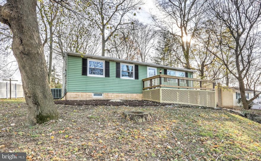 STUNNING country views from all directions with this beautifully updated rancher on a half acre lot! Relax on the spacious wrap-around composite deck overlooking pristine preserved farmland to the front. The large private backyard also backs up to preserved farmland. All new vinyl plank flooring and fresh paint throughout. This bright & sunny home features an eat-in kitchen with butcher block breakfast bar and under cabinet lighting, lower level family room and a lower level workshop. All appliances included!