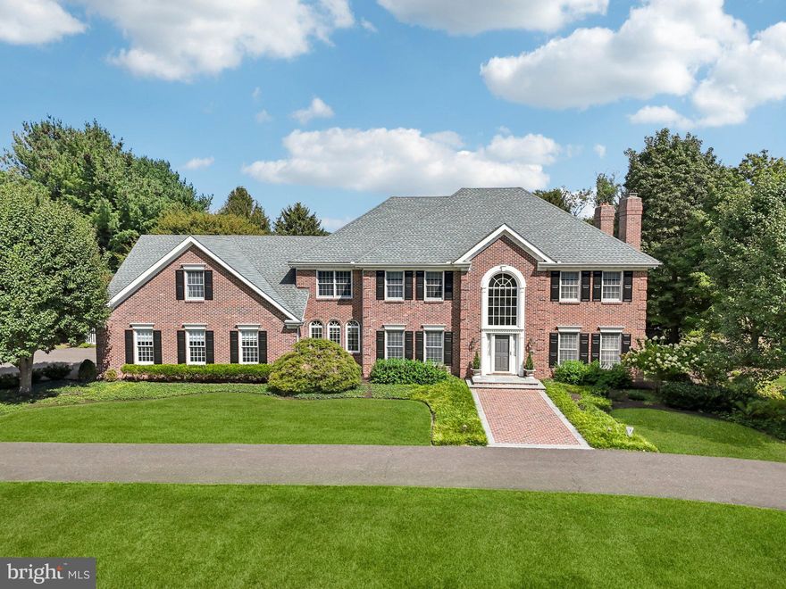 Welcome to 12 Paddock Drive, a nearly 5,900-square-foot residence set on 2 acres of beautifully landscaped grounds in the heart of New Hope, within the highly regarded New Hope-Solebury School District. This stately brick-front Colonial blends elegance with warmth, creating a home that feels both refined and inviting. The exterior is framed by mature trees, manicured lawns, and broad stretches of patio and decking that overlook an in-ground pool and rolling green space, an ideal backdrop for quiet mornings, lively summer gatherings, and everything in between. Inside, soaring ceilings and walls of windows fill the home with natural light, creating a bright and airy flow. Formal living and dining rooms are perfect for holiday entertaining, while the chefs kitchen, breakfast room, and family room connect seamlessly to the outdoors. A dedicated office on the first floor provides a comfortable space for work or study, while upstairs, a smaller bonus room offers flexibility as a library, reading nook, or playroom. Accommodations include a primary suite with an updated bath with walk-in closet plus four additional large bedrooms. Among them is a remarkable space with nearly 800 square feet of flexible living area that can serve as a second primary suite, game room, theater, or private retreat. Generous proportions, abundant storage, and timeless architectural details provide a strong foundation for your own vision and personal style. Beyond the home itself, the location is pure Bucks County magic: tree-lined streets, neighboring farms, and the convenience of being minutes from downtown New Hope, steps from Peddlers Village, and Lambertville. This is more than a home, it's a canvas for life's most meaningful moments. A place for barefoot summers, holiday traditions, and mornings that begin in peace and end together.