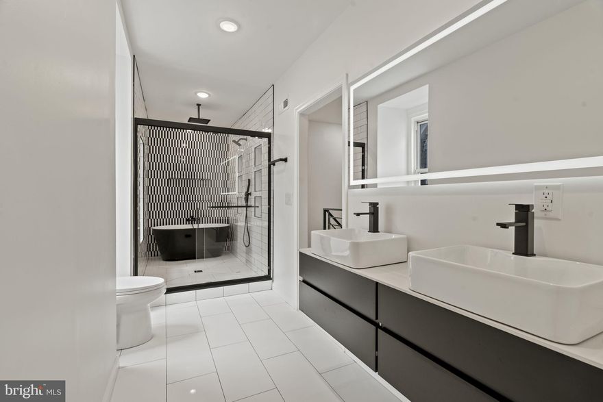 Welcome to this fully renovated Victorian twin offering exceptional space, modern luxury, and flexible living. The top level includes is a private master suite with a custom spa-style bath and large walk-in closet, as well as an additional bedroom/office/gym. The second level features 2 custom bathrooms and three bedrooms with designer finishes throughout.

A one-of-a-kind kitchen anchors the first floor, featuring custom cabinetry, premium countertops, and stainless steel appliances, flowing into a private rear yard ideal for entertaining. Additional highlights include in-home laundry, central air and HVAC, and a comprehensive renovation for true move-in-ready living.

Ideally located near Germantown Ave eateries, cafes, and amenities, with easy access to Center City, transit, and parks.

Rare size, condition, and layout at this price point. Schedule your showing today