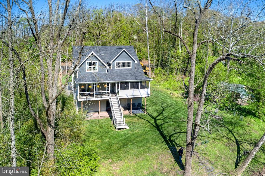 Welcome to this modern oasis nestled along the serene Perkiomen Creek and trail. This less than 4-year-old Custom Home with a transferable Builder Warranty, offers an elegant stay-cation lifestyle with stunning wildlife, nature, and creek views. Private .60 acre lot provides ample space for outdoor activities and relaxation. Private kayak or canoe launch and plenty of fishing. This lot is also surrounded by over 2 acres of preserved Montgomery County recreational land. The interior boasts a contemporary design with high-end finishes and an open layout, perfect for entertaining. Ample windows capture the picturesque surroundings, creating a resort-like ambiance. The modern kitchen features stunnig honed black granite, soft close shaker cabinets, Kitchen Aid appliances, Blanco undermount sink stainless steel sink, Reverse osmosis water filter, under cabinet dimmable lighting, and externally vented microwave range top. The family room features cathedral ceilings, stunning Heat-glo 6000 gas fireplace with upgraded options, hand forged fire screen with variable blower, real stone surround, and a wrap around mantel made from an 1800's barn beam. The family room also features french doors that lead to the screened in deck overlooking the creek. The primary bedroom offers a peaceful retreat with its own french doors that lead to the private deck overlooking the creek. The primary features a custom walk-in closet and an ensuite. The ensuite features a double sink vanity, free standing soaking tub, large tiled stall shower with a soapstone seat, and a private water closet. The laundry is conveniently located within the ensuite and features exquisite soapstone counters, built-in cabinets and a utility sink. The half bath finishes off the main floor. On the top floor there are 2 large bedrooms, a huge open loft, and a full bath. The 3 car garage features two storage rack systems, a storage wall and utility room. Upgrades include but are not limited to... energy efficient windows and doors, all back doors integrated with mini-blinds, all doors are solid core, the primary bedroom and primary bath upgraded with quiet rock (noise cancelling) sheet rock, entire home has upgraded insulation, Solid wrought iron balusters with upgraded newels, Hardwood and Luxury Vinyl flooring, Hardie Plank and Allura Concrete siding, Eufy Camera front door doorbell and security system, 2 Eufy security cameras with flood lights, 6 Nest integrated fire/CO2 alarm systems, 2 Nest Learning HVAC controls, Trex Deck with inlaid lighting, Electrical bypass backup system with whole house generator (generator is negotiable). Built on raised concrete with engineered Smart Vents and all utilities are above (2ft) the BFE or 100 year floodplain. Whether you're enjoying the outdoor deck, fishing, kayaking or exploring the nearby nature trails, this home provides a tranquil escape from the everyday. Embrace the beauty of nature from the comfort of this exquisite property.