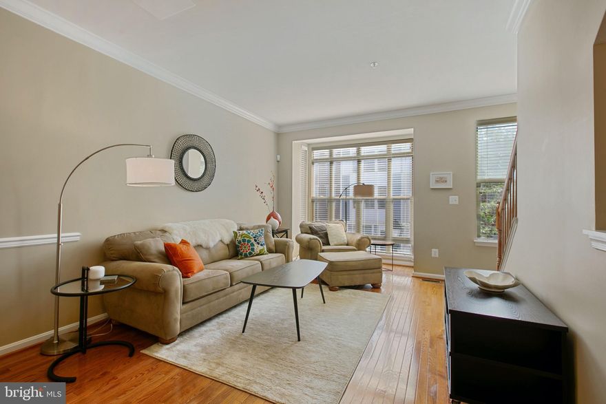 Welcome to 27 S Exeter, a prime Baltimore location! Pride of ownership shines in this 2 bedroom, 2.5 bath home with an attached garage and parking pad. A cozy den welcomes you into the main level, the space is perfect for a home office, gym or second living space. The second level features open concept living with hardwood floors, crown molding and ample natural light. The level is centered around a well organized  eat-in kitchen with custom cabinets, zodiac quartz countertops and a breakfast bar that opens to a large living room. The level is completed with a half bath, sitting area and a deck. The third level includes a primary suite with an attached bathroom with a soaking tub, two large closets and a deck. The second bedroom has a large walk-in closet and the level is finished with a second full bath. Move right in and enjoy all Baltimore has to offer with walking distance to Harbor East, Little Italy, Fells Point and the Inner Harbor.