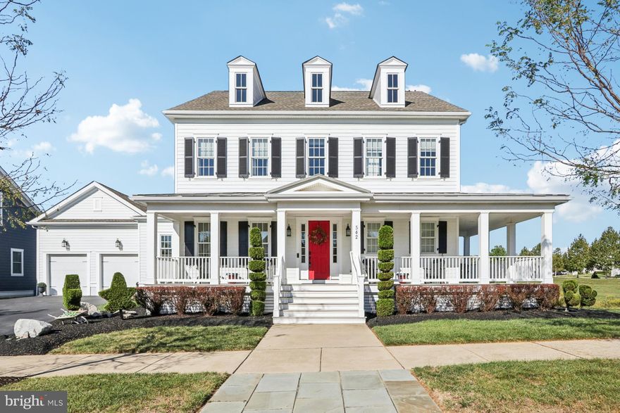 This stunning Modern Farmhouse offers the perfect fusion of luxury, comfort, and timeless design. With 5 spacious bedrooms, 4.5 bathrooms, and nearly 6,000 square feet of refined living space, this home is a masterpiece of craftsmanship and functionality. A wrap-around front porch welcomes you with warmth and charm, setting the tone for the exquisite interiors. Step inside to discover 7-inch wide Hardwood Oak flooring, custom millwork, and soaring 10-foot ceilings throughout.The formal dining room is ideal for hosting elegant dinners, complemented by a butler’s pantry featuring a wine fridge and a stylish half bath nearby. The expansive great room boasts coffered ceilings, custom built-ins, and a striking fireplace that is perfect for causal entertaining. Overlooking the great room is a gourmet kitchen outfitted with an oversized quartz island, premium gold star energy-efficient appliances, high-end custom cabinetry and sunlit breakfast room. A large pantry and laundry room are conveniently located just off the kitchen. The main-level primary bedroom is a serene retreat with its own gas fireplace and private access to the covered porch overlooking the tranquil pond. The spa-inspired ensuite bath features double vanities, an oversized shower, and a soaking tub. In the thoughtful upper-level design you will find a cozy family room, built-in workstation, a princess suite with a private bath, and two additional generously sized bedrooms connected by a Jack and Jill bathroom. The walk-out lower level is designed for fun and relaxation, complete with a custom bar, gaming area, fitness room, and more. Step outside to a beautifully crafted paver patio and enjoy peaceful pond views. Other exceptional features include: extensive custom woodworking, designer lighting, Hardie Plank siding, Anderson 400 windows, composite decking & built-in sound system.Best of all this home is perfectly sited on a premium lot bordered by parkland on three sides and is walking distance to parks, shops, dining, Wellness Center, Beer Garden, proposed Peach Market, and Lorewood Grove Elementary School 
 
This home is a rare opportunity to experience luxury living in one of Delaware’s most desirable communities. Schedule your private tour today and fall in love with everything this elegant Modern Farmhouse has to offer.