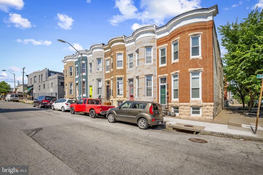 Welcome to 3501 Elm Avenue, a spectacular townhome in an incredibly convenient location with a contemporary feel.  This light-filled end-unit in historic Hampden is a rare find.  Hardwood flooring, exposed brick, recessed lighting and fresh paint abound.  An open floor plan on the main level, including a living room/dinning room combination, blends perfectly into a high-end kitchen.  It includes, granite counter tops, stainless steel appliances, and ample cabinet space with a breakfast bar making this design an entertainer’s delight.  This home, unlike most in Hampden, includes every modern convenience with a half-bath and laundry room on the main level, a mudroom on your way to your own private parking pad out back, and central A/C on all 3 levels!***Upstairs offers a sizable primary suite with a walk-in closet and walk-in shower.  A second suite down the hall connected to the hall bath finishes the space.  A roof skylight cascades light down through the 2 main levels, with light also streaming in through the unit’s south-facing windows, which run the length of the end-unit townhome.***A lower level provides a private finished 3rd bedroom with convenient closet space, recently installed Java Scraped Oak laminate flooring, and two windows providing natural light.  Additionally, a renovated artist studio featuring newly installed drywall, an epoxied concrete floor, plus expanded outlet access and lighting make this space an ideal location for an artist, musician, craftsman or all three.  A utility room with sump pump and direct access to the parking pad in back finalizes the lower level.  In a neighborhood with ever-growing popularity, having your own private parking pad is a must!***Hampden is known for its prime location, complete with restaurants, coffee shops, the Rotunda, galleries & the occasional festival.  With Stony Run & Wyman park near by, you have the best of both worlds.  Institutions such as the Baltimore Museum of Art & Johns Hopkins only enhance the value of this location.