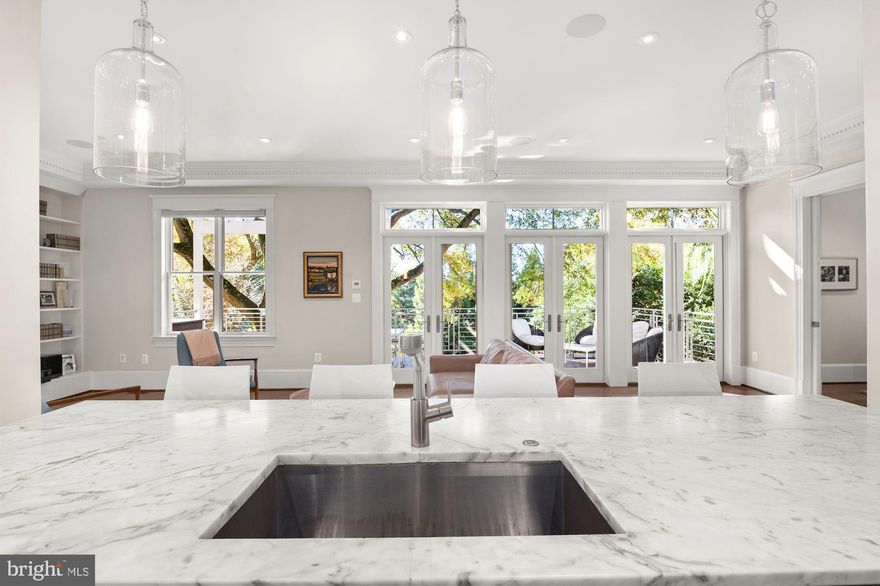 NEW PRICE! Best value in upper NW DC – 2015 new build with 7,900 total interior SF on enormous 0.55 acre parcel! Have to walk through it to believe it – tremendous scale, stunning design, handcrafted millwork, and generous proportions. Prime location with walking distance to MacArthur Blvd / Palisades commercial corridor and easy access to parkland and trails. This incredible residence offers 6 Bedrooms, 6 Full Baths, and 2 Half on four levels – with generous casual spaces including the extremely large eat-in kitchen with custom cabinetry galore, adjoining family room, and the top floor rec room with wet bar and exterior loggia with scenic panoramic vistas.  The wonderful curb appeal begins with the New England style cedar shake siding and continues with the flagstone walkway, lush landscaping, and wood trimmed windows. From each of the oversized windows, the views of the surrounding trees are breathtaking. The rear garden is anchored by a gorgeous antique White Ash tree and features a large Patio, an Outdoor Kitchen that includes a Pizza Oven imported from Naples, and a koi pond with a cascading waterfall. There is an attached 1-Car Garage and a Driveway for additional off-street parking.