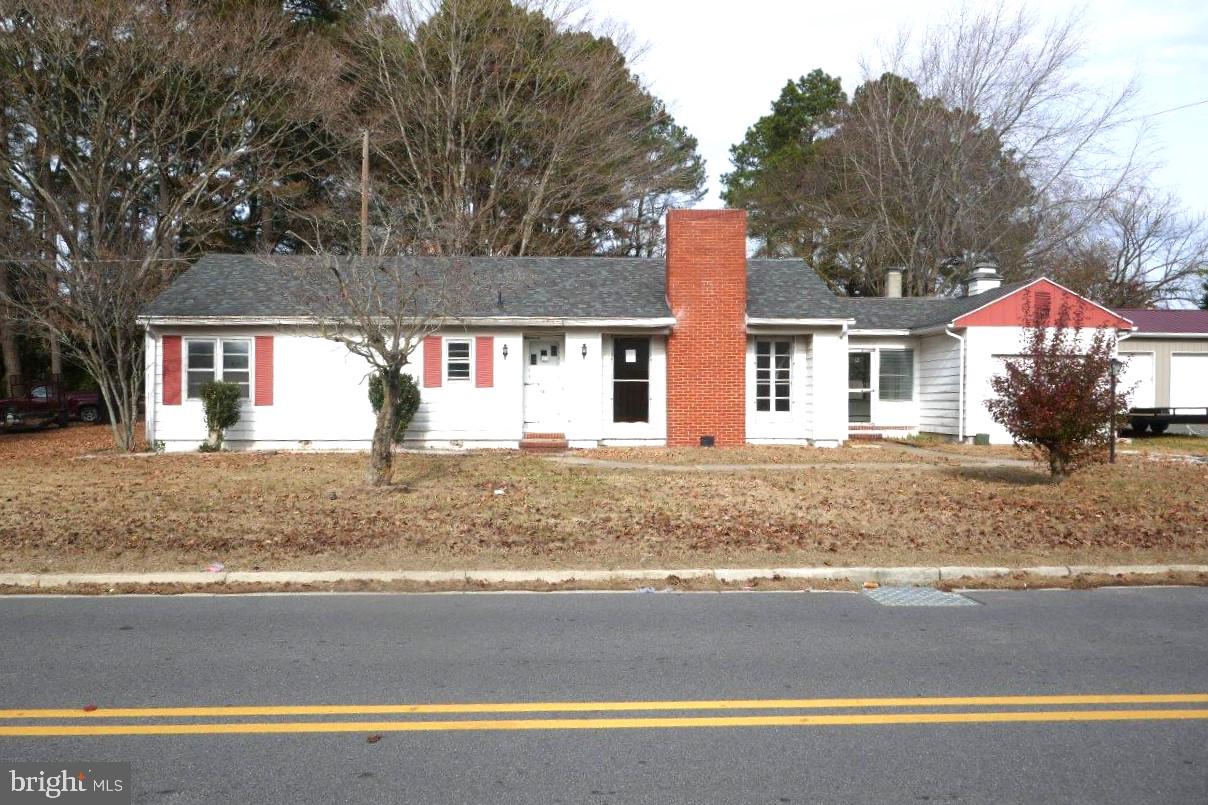 Welcome to this charming 3-bedroom, 1-bathroom ranch-style home, nestled on a generous 0.53-acre lot. Step inside to discover a traditional floor plan that maximizes space and flow. The inviting living area features a cozy fireplace, perfect for relaxing evenings. The kitchen is equipped with essential appliances, including an electric oven/range, refrigerator, and range hood, making meal preparation a breeze. Convenience is key with laundry facilities located on the main floor. The attached garage offers convenient parking and storage options, while the expansive lot provides ample outdoor space for gardening or entertaining. This property is not just a house; it's a place to call home. Don't miss the opportunity to make it yours! Schedule your showings now!