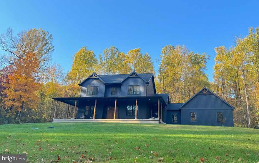 Welcome to your dream home! Nestled on almost 4.5 scenic acres in Thurmont, MD. This property is perfect for nature lovers or anyone seeking tranquility and privacy. While still being just minutes from Rt 15 and the quaint town of Thurmont. From the moment you step in the door you'll be greeted by a bright and airy space filled with natural light and high-quality custom features throughout. The focal point of the living area is a gas fireplace wrapped in stone from the floor to the vaulted ceiling, that combined with the oversized windows the natural light just pours in enhancing the warm and inviting atmosphere. Flowing seamlessly into the gourmet kitchen, you will find custom cabinetry with flawless granite counter tops, and stainless steel appliances. Throughout the home you'll find durable LVP flooring that offers style and resilience. The three full bathrooms each feature a ceramic tile floor, ensuring durability while keeping a modern look. The first floor primary suite serves as a serene retreat filled with natural light provided by your French doors leading to a large, lush backyard, a walk-in closet with plenty of storage space all around, and a spa-like en-suite bathroom. The primary bath is designed with a large, enclosed glass shower with two shower heads and a double vanity, combining luxury and practicality. Heading upstairs you'll find two additional bedrooms that provide generous space each with their own closet. They both provide lots of natural light with views of the front yard leading into the woods enhancing the serene feel. Beneath the main floor you'll find an unfinished basement offering a generous amount of storage space. The two-car attached garage is conveniently located on the side of the house providing easy access. The exterior provides a large, covered front porch complete with a porch swing perfect for enjoying those quiet mornings. Complete with a massive yard, it's an ideal setting for both tranquil solitude and vibrant outdoor gatherings. Located just minutes from nearby amenities, this home has so much to offer! You won't want to miss it. Schedule your private tour today and discover the home of your dreams!