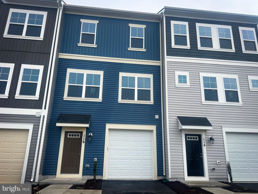 Brand New townhome with 4 bedrooms and over 2,000 sq ft of living space, is ready for move in! With special financing and closing cost assistance available, there is no reason to wait to make this the next place you call home!
The kitchen its outfitted with a super island, white and grey cabinetry, quartz counters, stainless steel appliances. Natural light flows through the kitchen into the family room.  Deck off of the rear is perfect for relaxing or entertaining! 
Head up the staircase to the upper level to the primary suite with a large walk-in closet and ensuite. Additionally, there are two secondary bedrooms, a full bath, and a conveniently located laundry area. The finished lower level offers a rec room and powder room expanding your living space.
Located in Snowden Bridge, a premier master-planned community with exceptional amenities including a swimming pool, pirate water park, indoor sportsplex, community park, fenced in dog park, and playground. In addition, there is a bike track, walking trails, and a picnic pavilion. You won’t have to leave to have fun, but when you do, you’re just minutes from all the convenience and entertainment around Winchester.