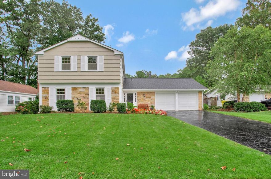 Roxbury model in desirable & charming Crofton! Welcoming entry with a walk-in closet for all the coats, scarves & boots in our lives. Sun-filled living room with 4 windows, crown molding, recessed lighting & wood floors and is open to the formal dining room. The family room off the kitchen has a wood-burning fireplace - so cozy during the winter months! Spacious eat-in kitchen with a spot for everything! 42' wood cabinets, Silestone counters and stainless-steel appliances - truly the heart of this home. A sliding glass door leads you to the fabulous SUNROOM with cathedral ceilings, 4 skylights and windows all around   it truly brings the outside in!  Enjoy outdoor gatherings in the fenced & landscaped rear yard with a deck and a fire pit.  There's plenty of room to plant & play. Don't worry about watering the lawn & garden, just set the sprinkler system and be done!  The main level laundry room has brand new LG washer & dryer and storage too! The 2-car garage has room to tinker and lots of storage too - including the attic above! The second level has 4 bedrooms! The primary suite includes a spacious bedroom with 3 windows, a walk-in closet plus another closet with shelving. The ensuite bath has a brand new walk-in shower with glass door. Three additional nice-sized bedrooms share the spacious hall bath with a tub/shower new laminate flooring graces the 2nd level. Updates include interior & exterior painting, double-paned windows,  roof, and a high-efficiency HVAC system. This home seamlessly combines style and practicality for a truly exceptional living experience. Located in the desirable Crofton Triangle, Crofton Woods/Crofton Middle/New Crofton High School District. Make sure to join the Crofton Swim & Tennis Club or the Crofton Country Club. You will love living here!