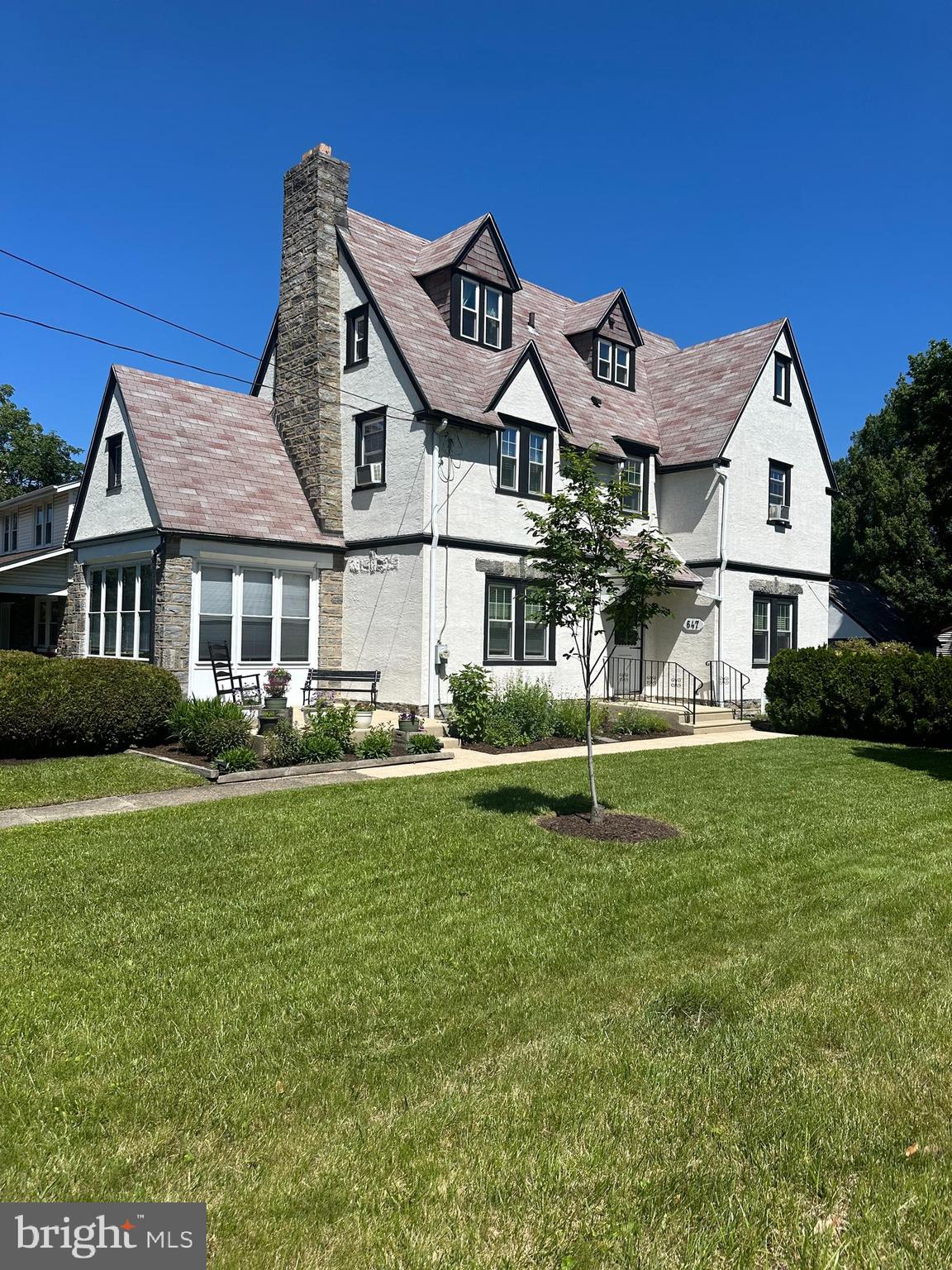 This classic and spacious center hall colonial is only made available due to a job relocation. Situated on one of the prettiest streets in the heart of Drexel Hill lies this 5 bedroom 2 bath home boasting a private driveway, 2 car detached garage and incredibly gorgeous grounds featuring many perennial gardens for you to enjoy! Can't beat this location... 20 minutes to Phila Int'l Airport, just around the corner to the trolley and/or bus or a short drive to the train makes commuting to downtown Philly or Media a breeze. Within walking distance to local eateries, shoppes and stores. First floor - A welcoming front patio greets you on your way into the center hall and leads to a stone fireside living room, sun room/porch, dining room , eat-in kitchen with breakfast alcove w/bay window and door to the driveway. Second floor - large primary bedroom w/walk-in closet or office, 2 additional nice sized bedrooms and an updated main bath. Third floor - 2 bedrooms with custom built-ins and a newer hall bath. Make this one your next "Home Sweet Home"!