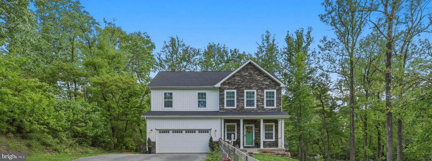 Nestled in the serene Blue Ridge Acres of Harpers Ferry, WV, this charming Colonial-style home offers a perfect blend of comfort and modern living. Built in 2022, this residence boasts a thoughtfully designed space, featuring 4 spacious bedrooms and 2.5 bathrooms. The home is complemented by luxury vinyl plank flooring and cozy carpet, creating a warm and inviting atmosphere throughout. Additional space in the unfinished walk-out basement presents a blank canvas, ready for your personal touch—imagine a game room, home gym, or additional living space tailored to your lifestyle. The upper level laundry makes chores a breeze. Step outside on to the maintenance free deck and discover a generous 0.51-acre lot, partly wooded and offering a sense of privacy amidst the natural beauty of the surrounding mountainous landscape. The rear yard is fully fenced and is perfect for outdoor gatherings, gardening with conveying raised garden beds, or simply enjoying the tranquility of rural living. Community amenities include a refreshing in-ground pool, perfect for those warm summer days. With an attached garage and ample driveway space, convenience is at your fingertips. The home generator and owned gas tanks provide a sense of security and protection if needed. This home is not just a place to live; it’s a sanctuary where memories are made. Experience the perfect blend of comfort, community, and nature in this delightful property. Minutes to the VA line make this home a commuters "dream come true"! Schedule your private tour!
