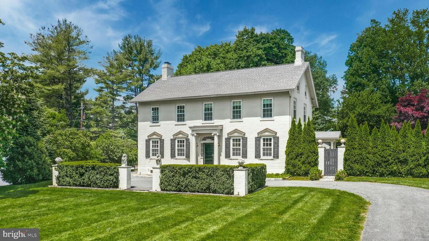 A premier property on Bethlehem’s coveted Main Street extension, this beautiful Georgian colonial dates back to the city’s earliest days. Once belonging to the family that lent its name to Moreland Avenue, Moore Estate has been restored and remodeled, thoughtfully marrying form, function and history with wonderful updates. Recently renovated, the primary bath has Carrara marble floors, vanity and a custom glasswork shower with marble tiles and antique brass. The current owners commissioned a historic restoration contractor to restore all wood flooring, doors and woodwork throughout the house.
A winding driveway with brick pillars is the introduction to this grand estate, with mature landscaping, high hedges and Belgian block trim. Deep-silled windows and antique lighting accent the gracious living room with fireplace, and dining room. A fabulous custom kitchen has lacquered cabinetry and high-end Miele appliances. A half bath and family room with laundry closet complete this level. Upstairs, the primary suite is luxurious with abundant windows adorned with brand new Belgian linen shades, and newly renovated marble bath. Three more large, recently renovated bedrooms are on this level, along with a well-appointed hall bath.
Outside, a covered patio leads a European-style oasis with bluestone terrace, built-in fountain and breathtaking, in-ground pool completed surrounded by ivy-covered fencing and brick pillars for ultimate privacy. A 3-car detached garage, wide lawn and garden shed are welcome amenities.